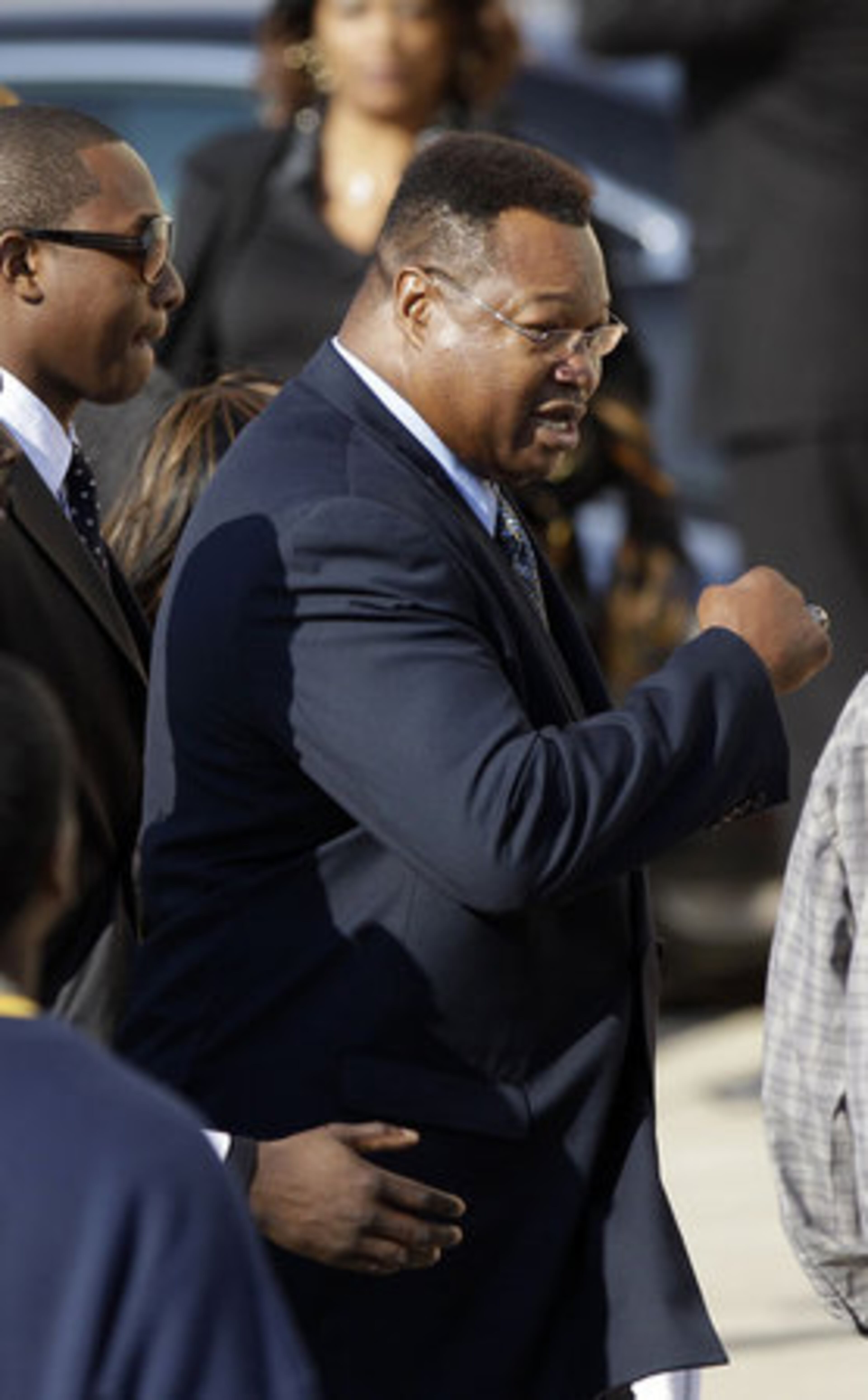 Former boxing champion Larry Holmes leaves after a memorial service for boxing legend Joe Frazier at the Enon Tabernacle Baptist Church Monday, Nov. 14, 2011, in Philadelphia.