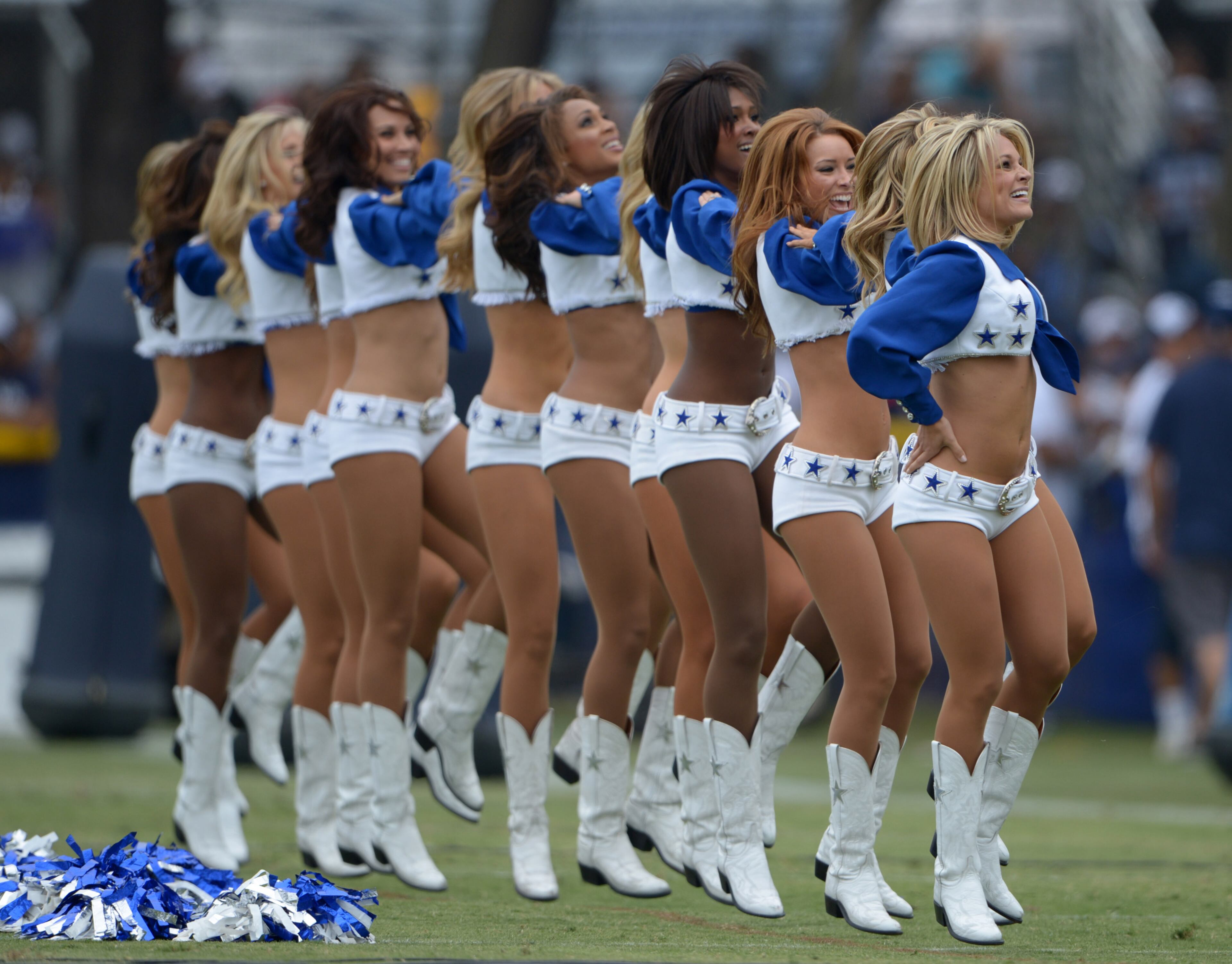 Dallas Cowboys cheerleaders work together.