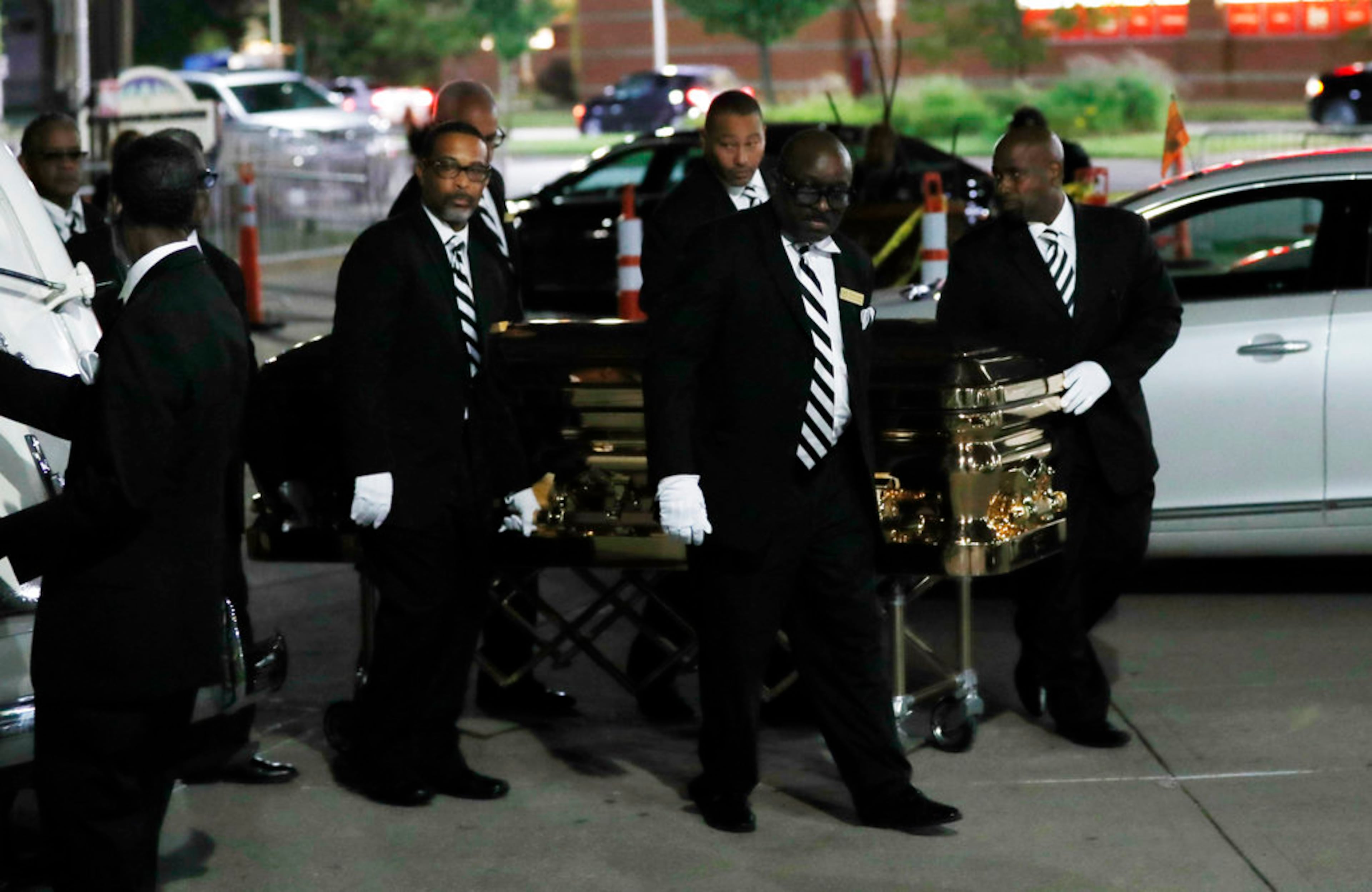 The gold casket of legendary singer Aretha Franklin leaves the Charles H. Wright Museum of African American History, late Tuesday, Aug. 28, 2018, in Detroit. Franklin died Aug. 16 and will be laid to rest on Friday after several days of tributes in Detroit. (AP Photo/Carlos Osorio)