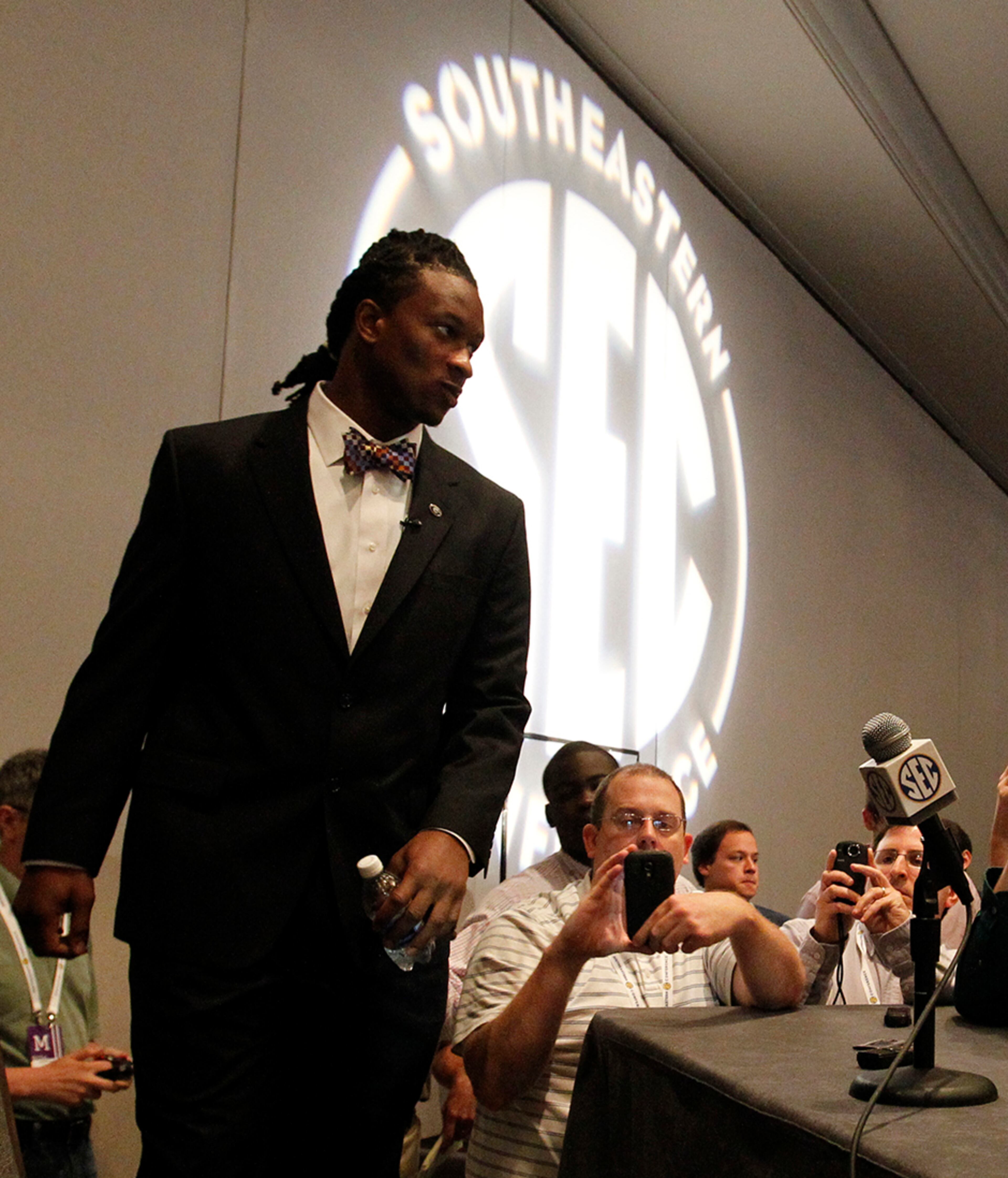 Georgia tailback Todd Gurley walks in to speak to media at the Southeastern Conference NCAA college football media days on Thursday, July 17, 2014, in Hoover, Ala.