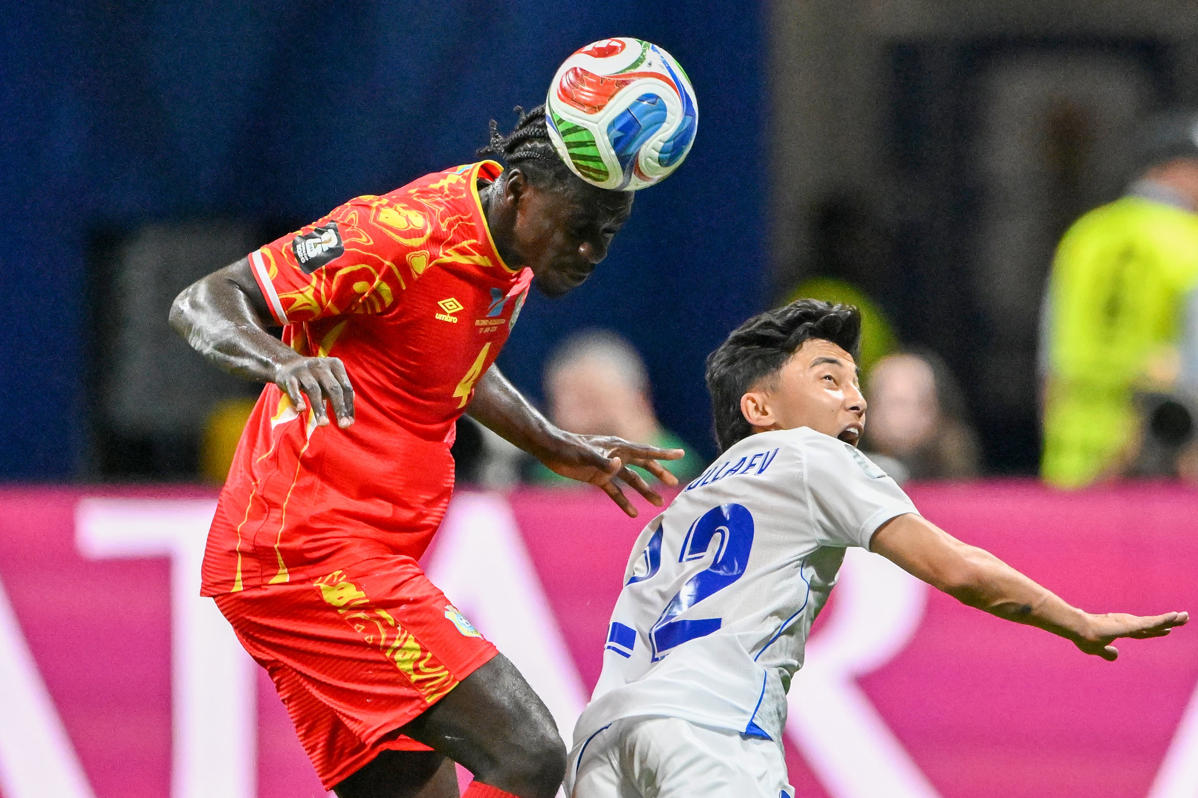 Congo defender Axel Tuanzebe (left) and Uzbekistan midfielder Abbosbek Fayzullaev (right) battle for control during the first half of a FIFA World Cup match at Atlanta Stadium (Mercedes-Benz Stadium) on Saturday, June 27, 2026, in Atlanta. (Hyosub Shin/AJC)