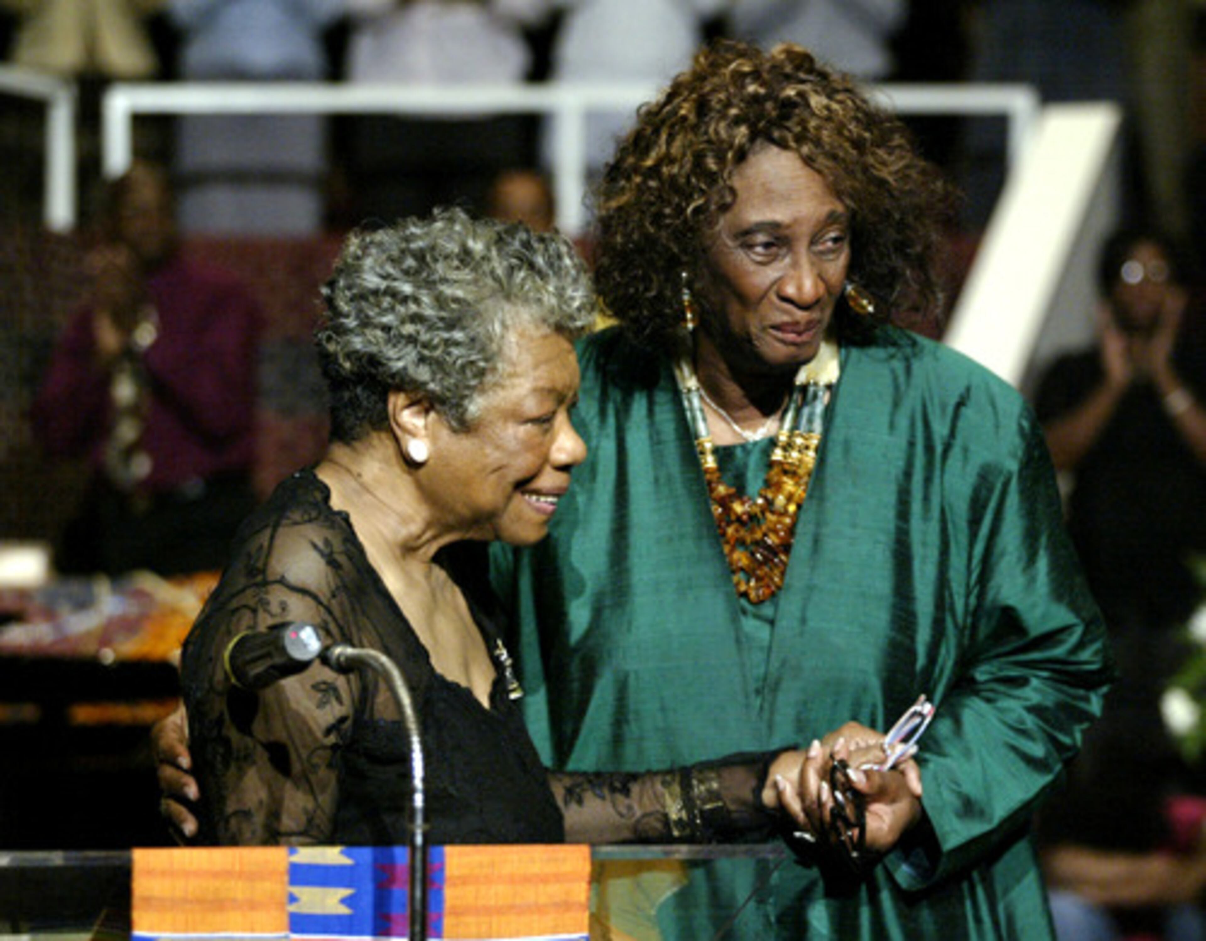 Poet Maya Angelou (left) receives a hug from the Rev. Barbara L. King on Sunday at Hillside International Truth Center in Atlanta. The occasion was the 36th anniversary of the center, which was founded by King.