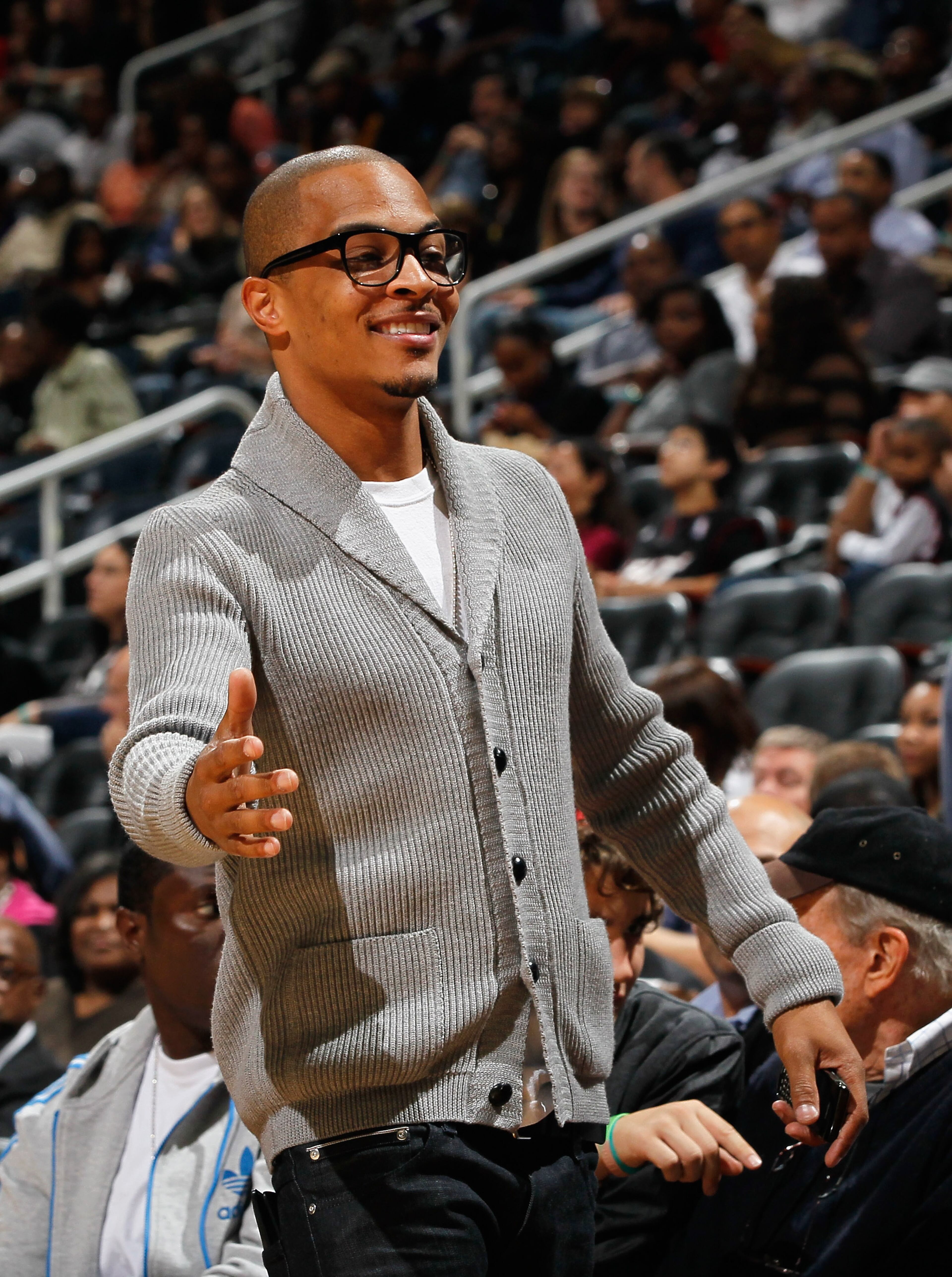 Rapper T.I. looks on during the game between the Miami Heat and the Atlanta Hawks at Philips Arena on Oct. 21, 2010, in Atlanta.