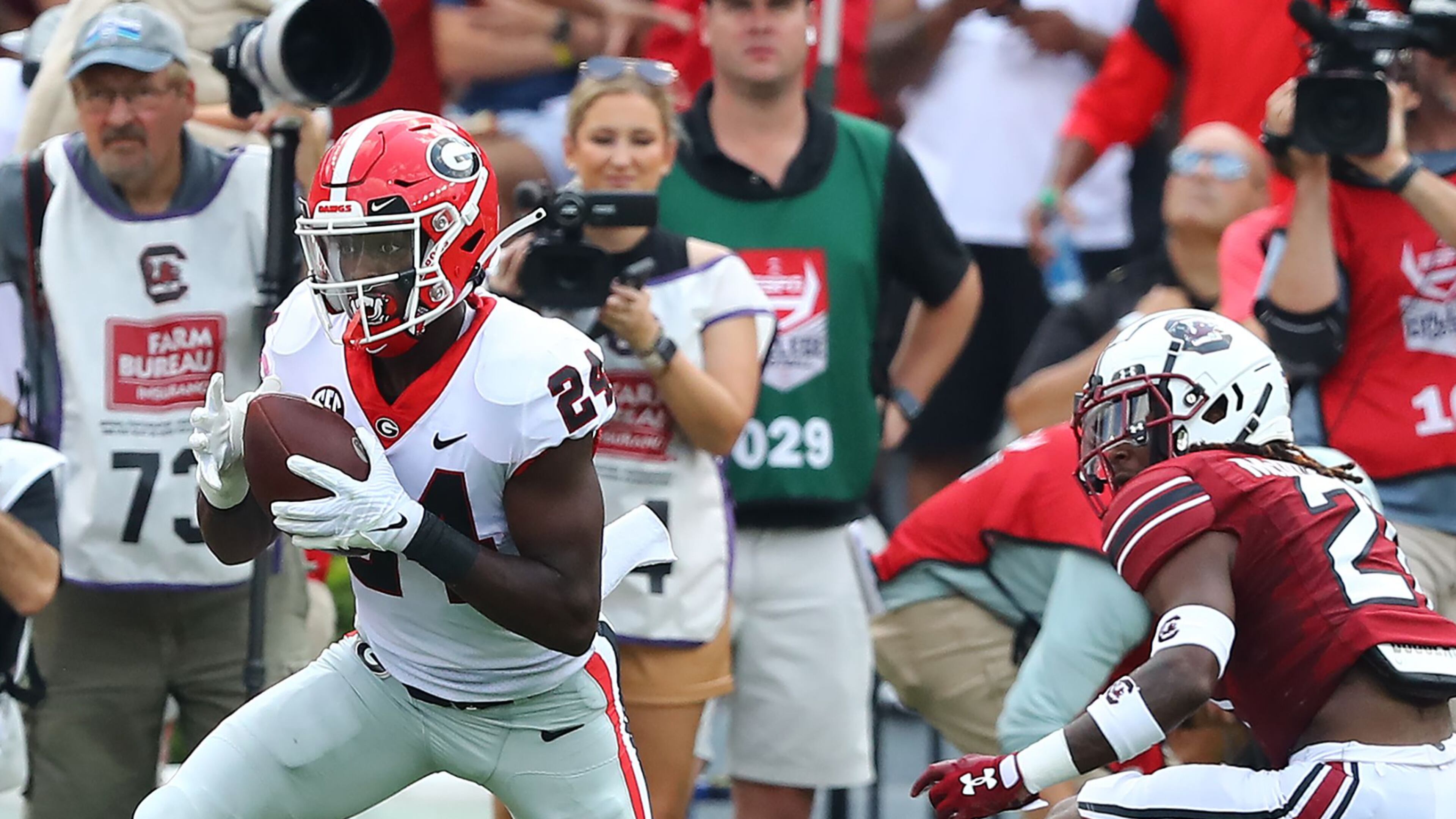 Georgia defensive back Malaki Starks intercepts a Spencer Rattler pass intended for South Carolina running back Juju McDowell and makes a long return setting up a Georgia scoring drive during the first quarter in a NCAA college football game on Saturday, Sept. 17, 2022, in Columbia. “Curtis Compton / AJC file"