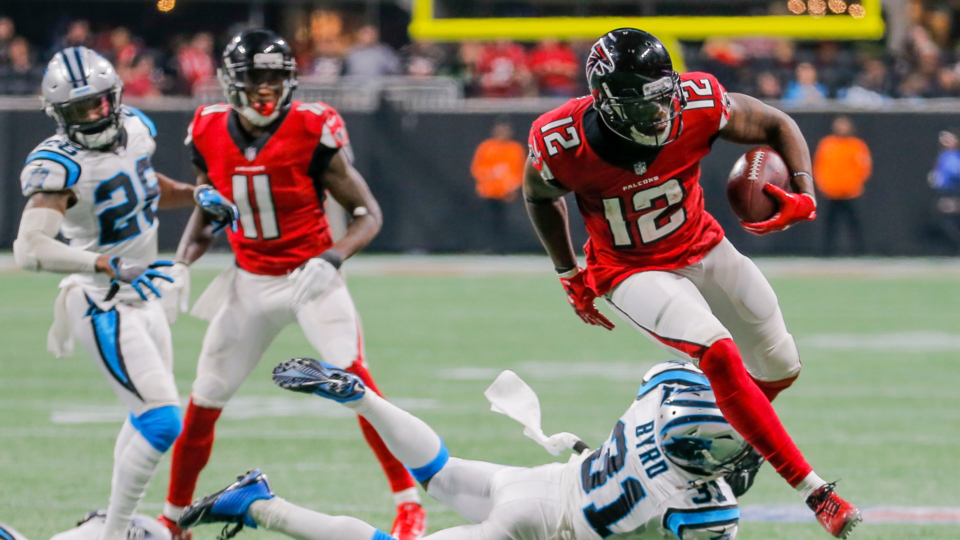 Carolina Panthers defensive back Jairus Byrd (31) looks to tackle Atlanta Falcons wide receiver Mohamed Sanu (12) during the second half of the game at Mercedes Benz Stadium, Sunday, December 31, 2017. Although the ball was caught in the end zone, the play was not ruled a touchdown. ALYSSA POINTER/ALYSSA.POINTER@AJC.COM