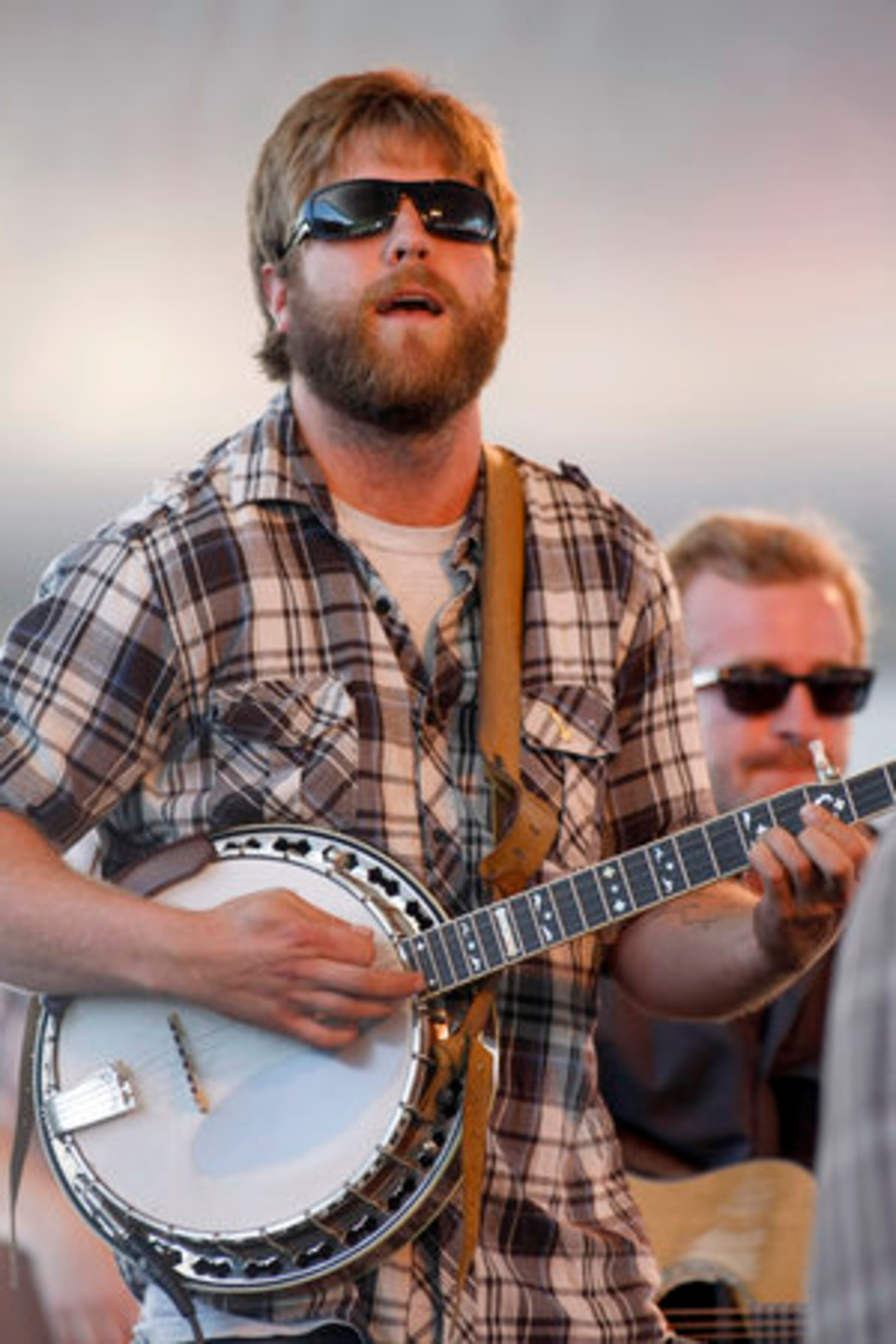 Dave Carroll of Trampled By Turtles plucks the banjo.