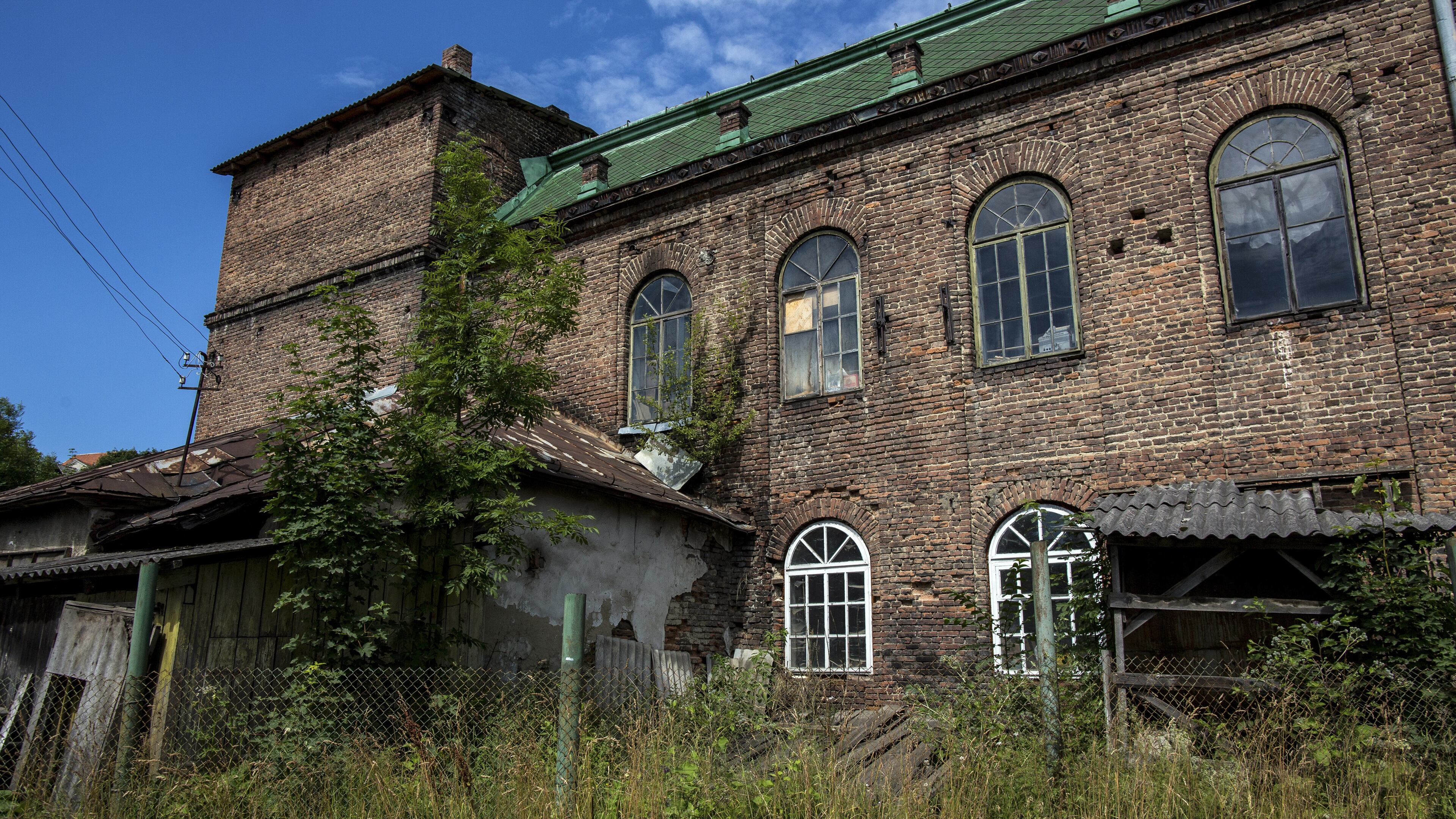 A former synagogue in Turka, Ukraine, near Borynya. A writer and his sister journey to the childhood homes of their Polish parents, places where once Jews like them could thrive. (Daniel Rodrigues/The New York Times)