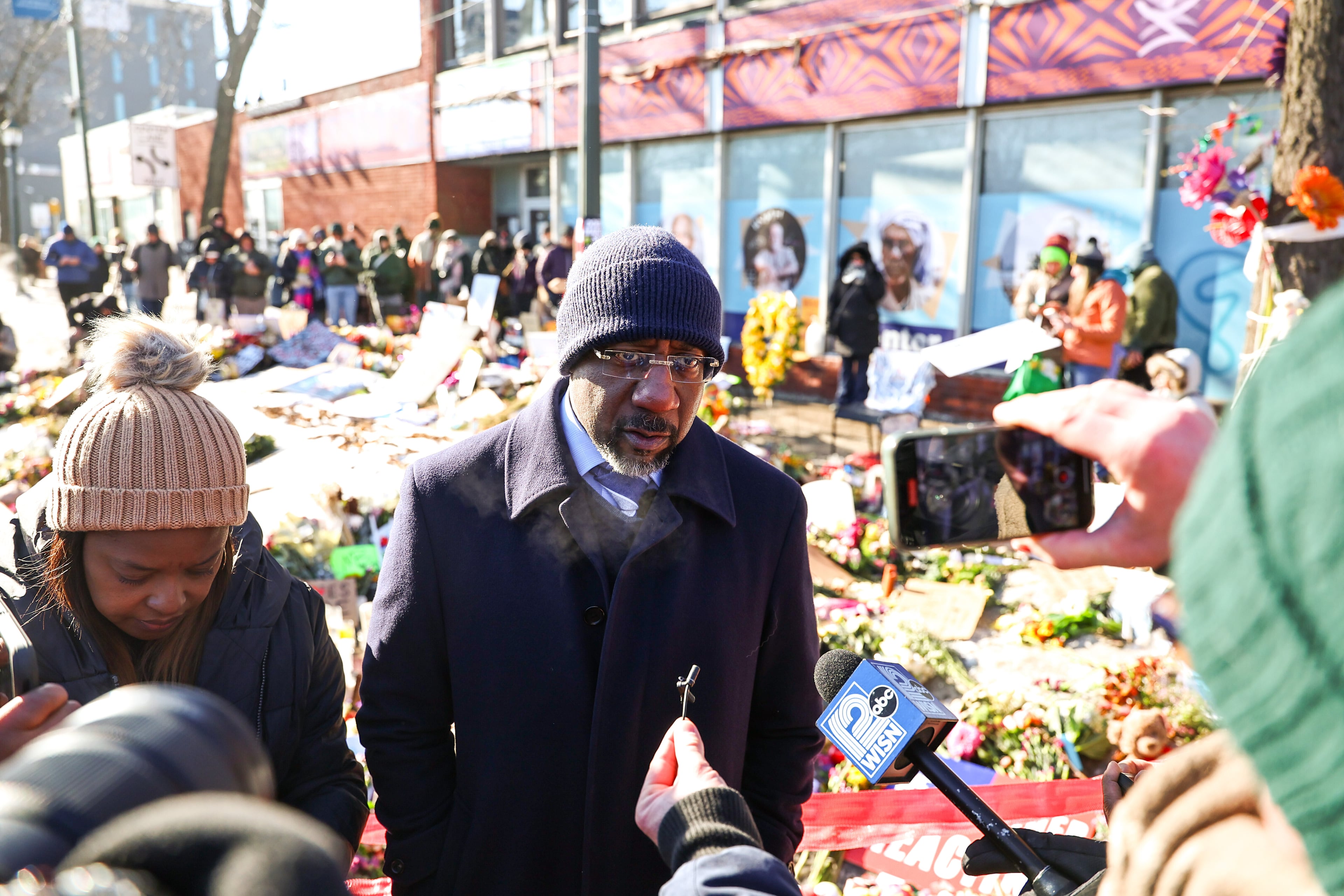 U.S. Senator Rev. Raphael Warnock, D-Ga., visits the memorial of Alex Pretti in South Minneapolis, on Jan. 27, 2026. Alex Pretti, 37 years old, was shot and killed by federal officers on January 24 in South Minneapolis while officers conducted operations in the area. (Steven Garcia/NurPhoto via AP)