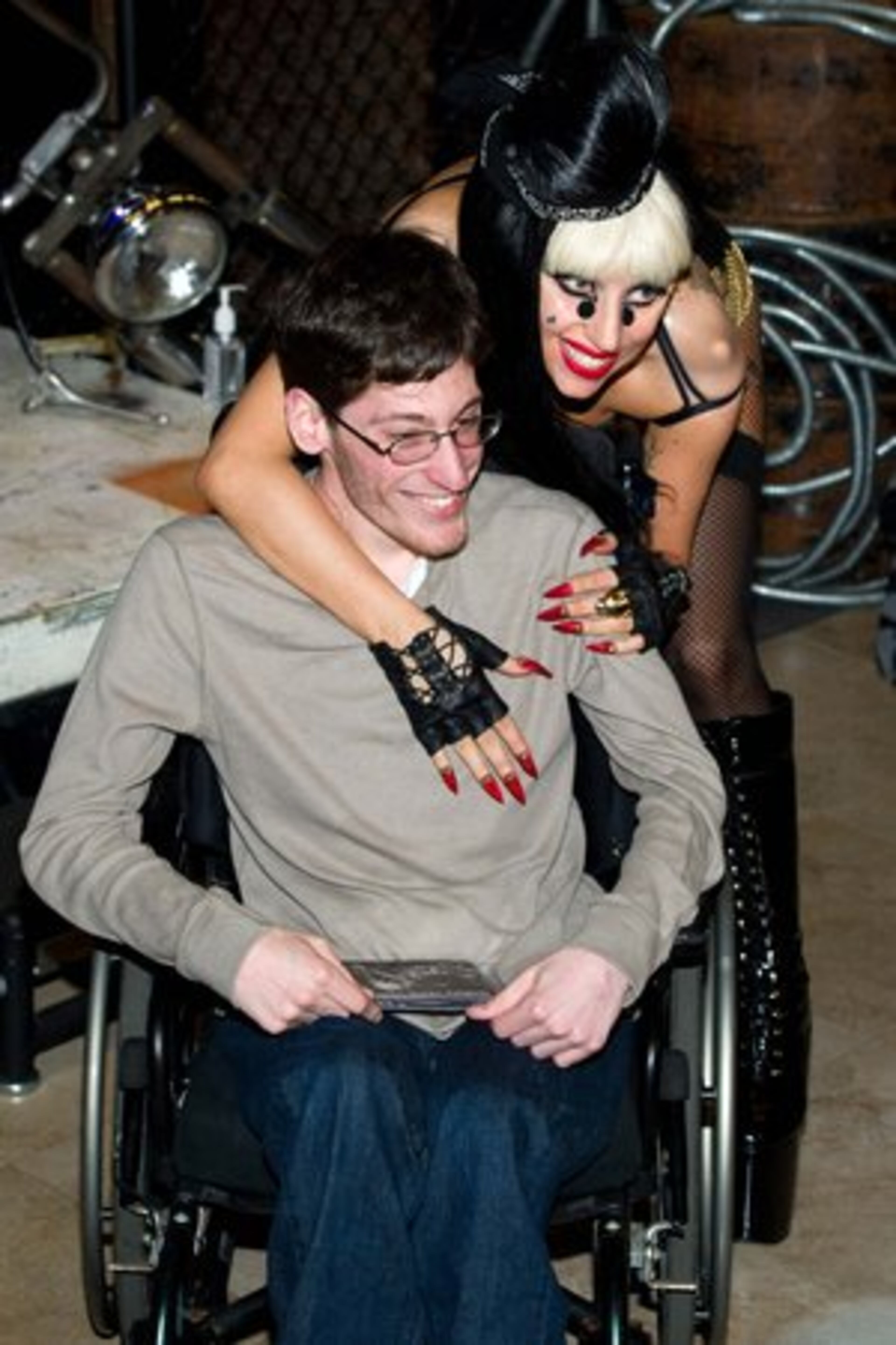 Lady Gaga meets with a lucky fan at a CD signing event.