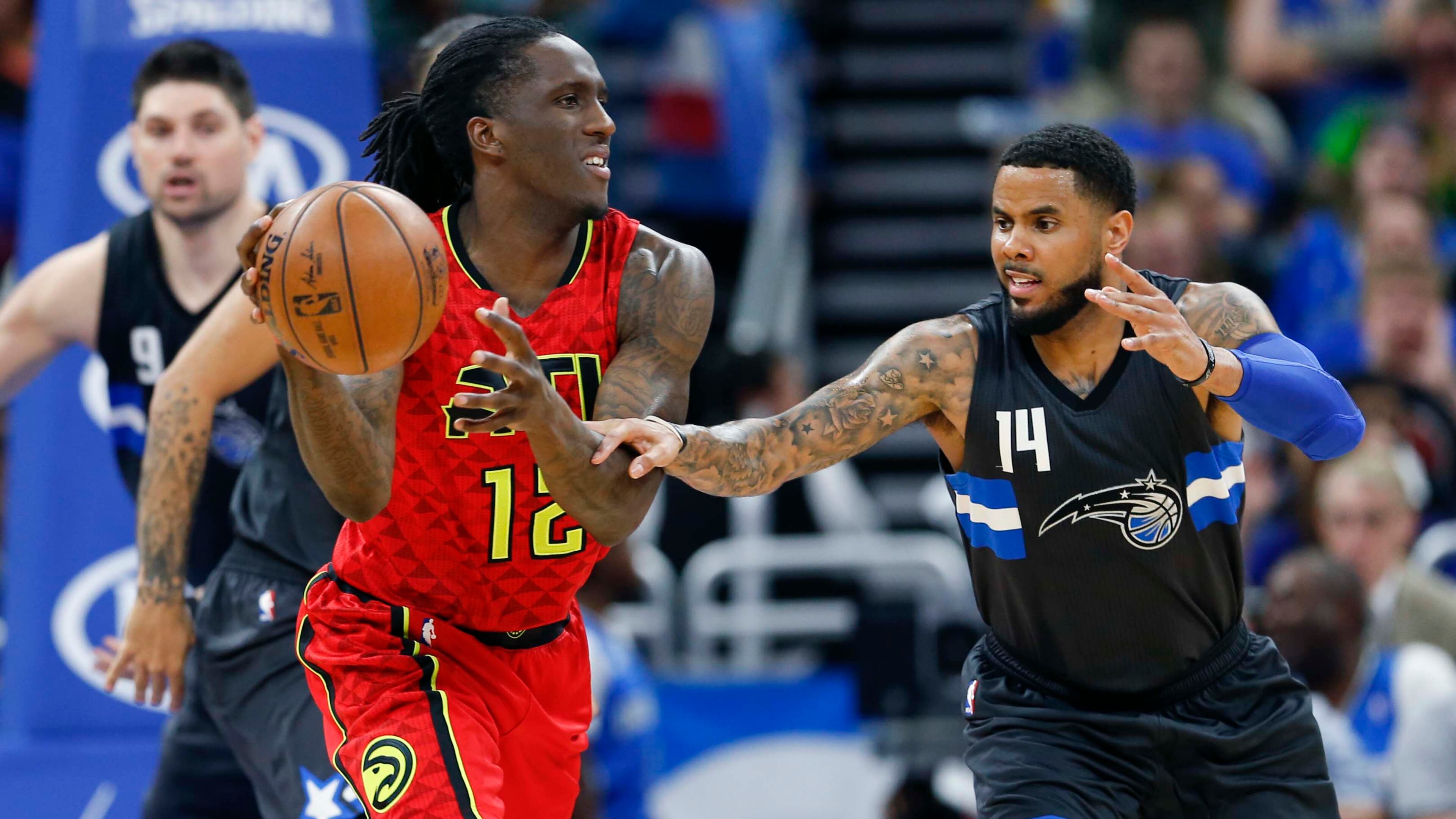 Orlando Magic guard D.J. Augustin (14) chases Atlanta Hawks forward Taurean Prince (12) during the second half of an NBA basketball game in Orlando, Fla., on Saturday, Feb. 25, 2017.The Magic won 105-86. (AP Photo/Reinhold Matay)