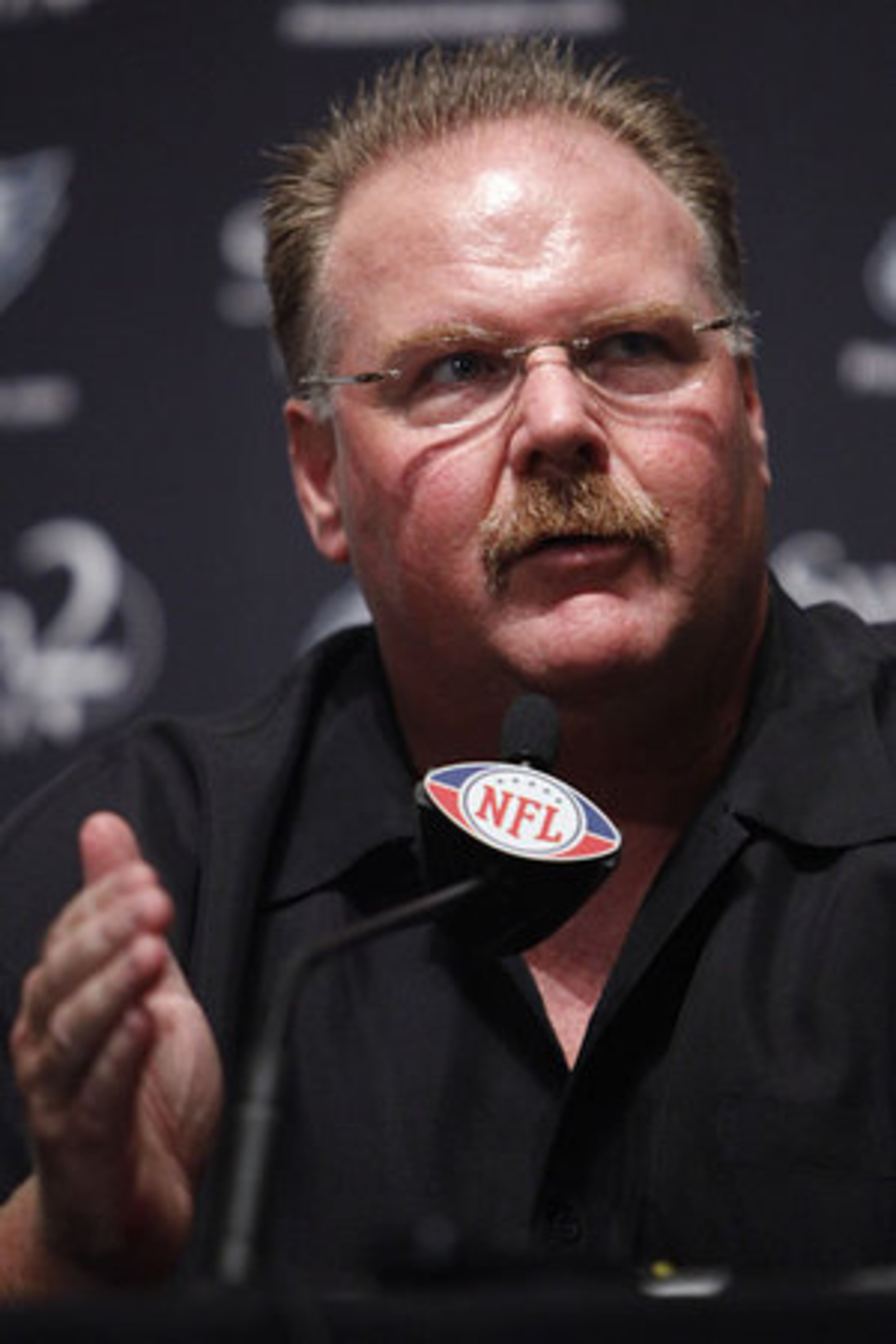 According to the Eagles' team Web site, Vick has been listed as a "quarterback/wide receiver/football player," suggesting head coach Andy Reid (above) is likely to play Vick at multiple positions. -- Mike Morris, AJC