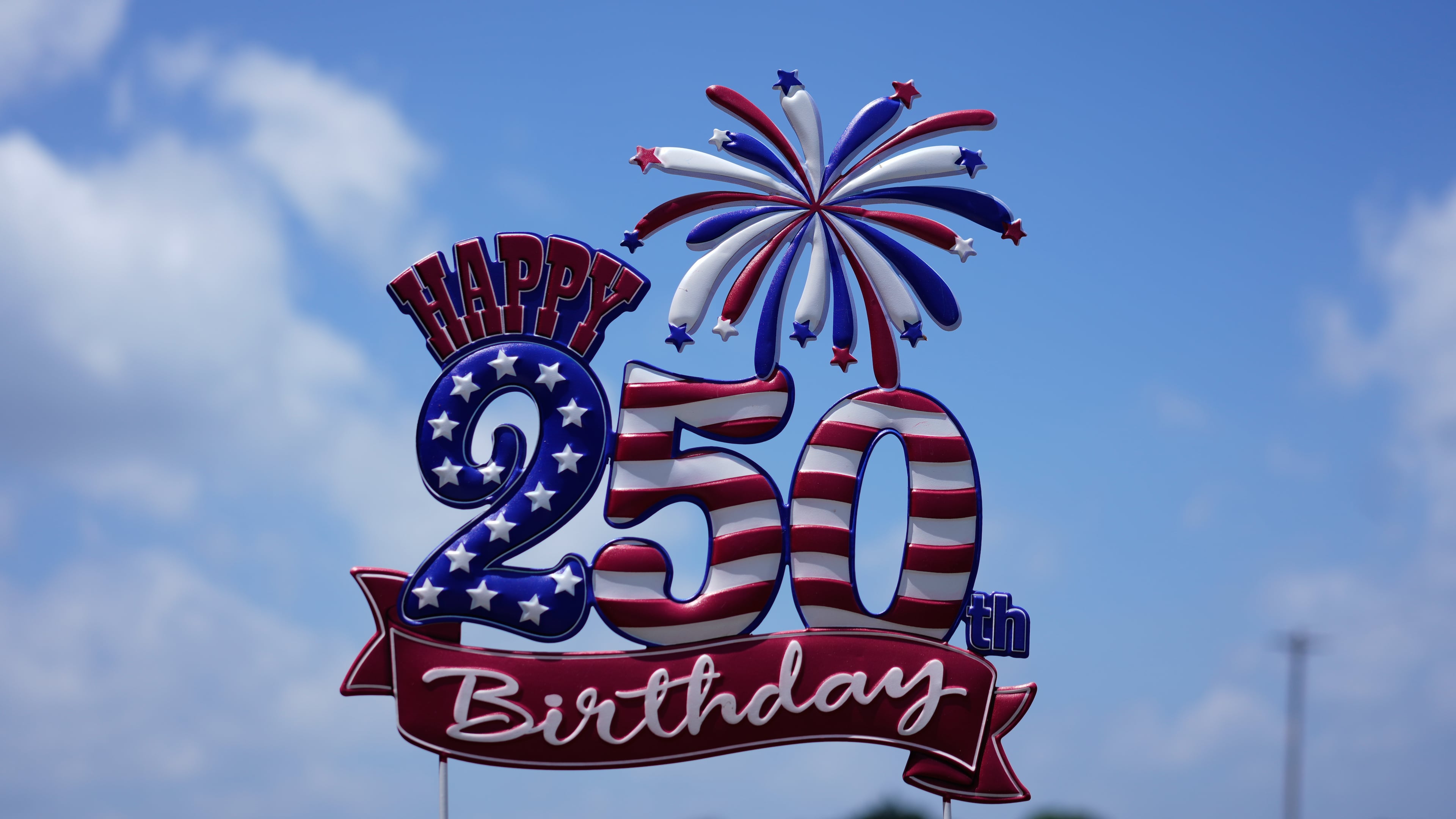 A "Happy 250th Birthday" signs seen near the entrance at Lucky Patriot Fireworks in Batavia, Ohio, Tuesday, June 30, 2026. (AP Photo/Carolyn Kaster)