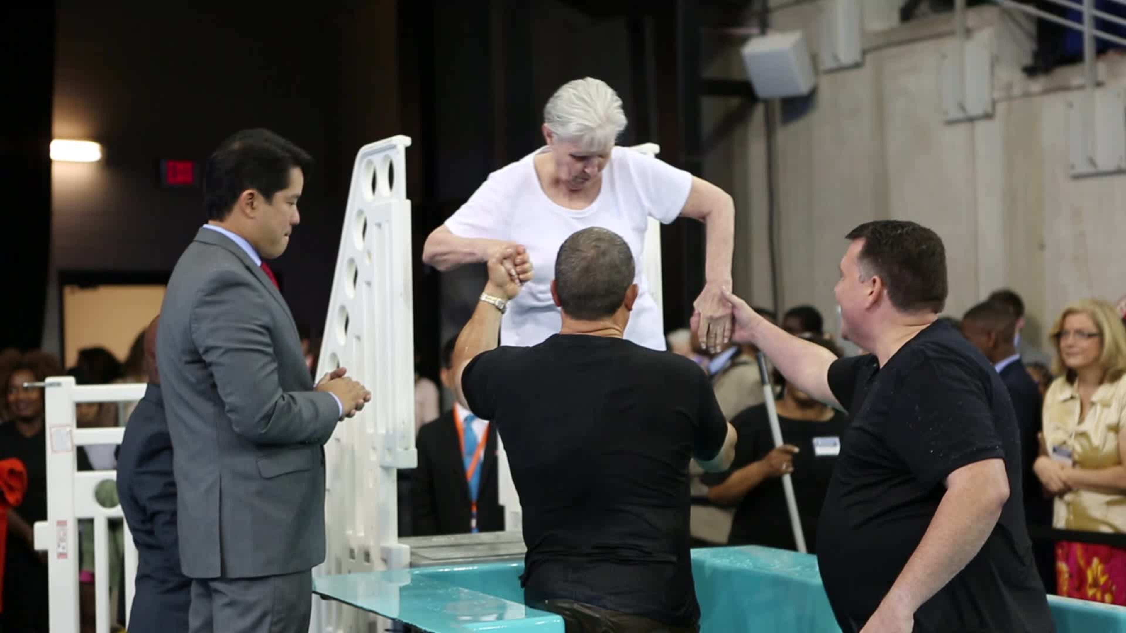 A woman gets baptized at one of the Jehovah Witnesses’ conferences in Georgia. CONTRIBUTED