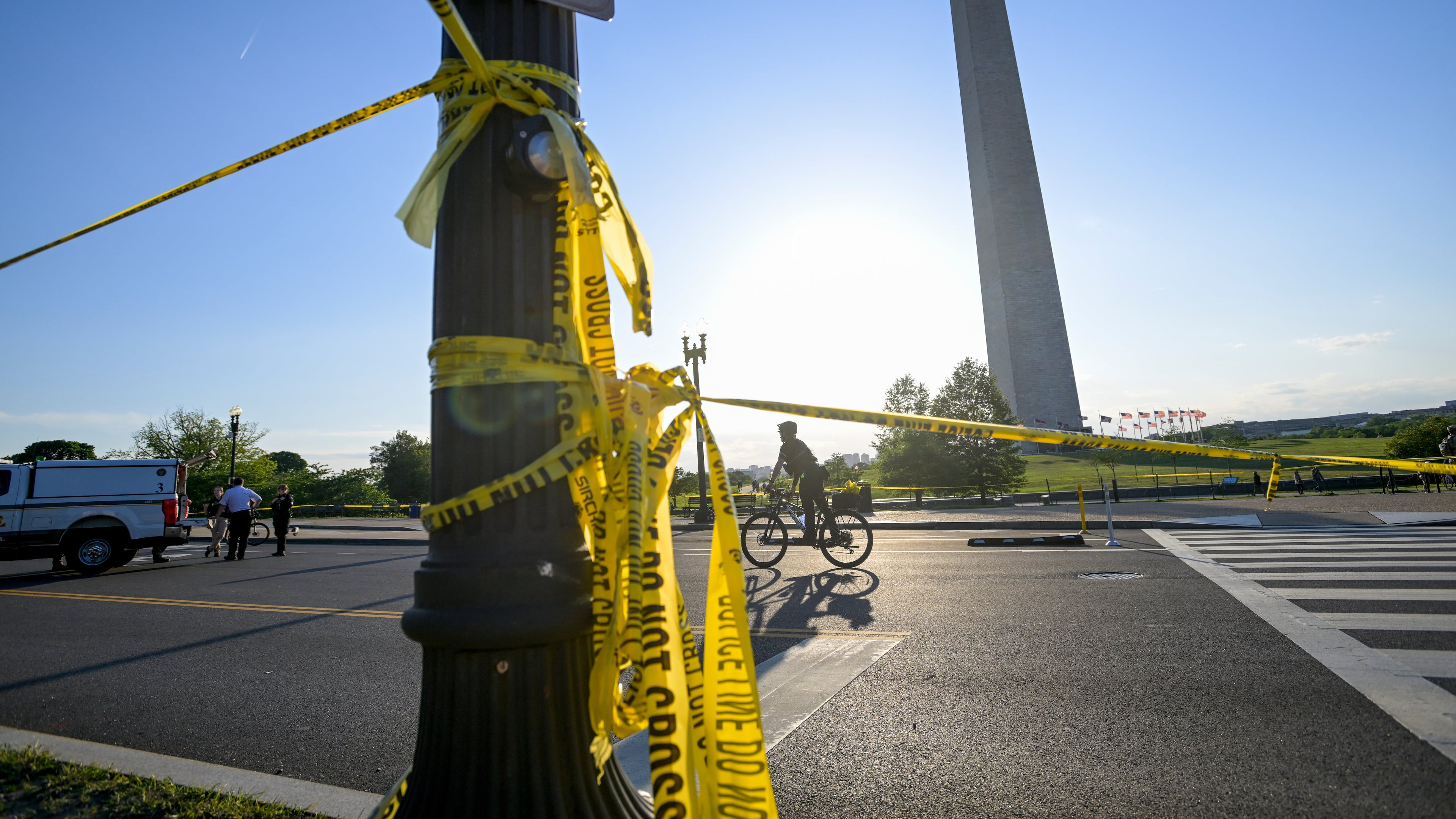 FILE - Police tape remains around the scene after a person was shot near the Washington Monument in May 4, 2026, in Washington. (AP Photo/Rod Lamkey Jr., File)