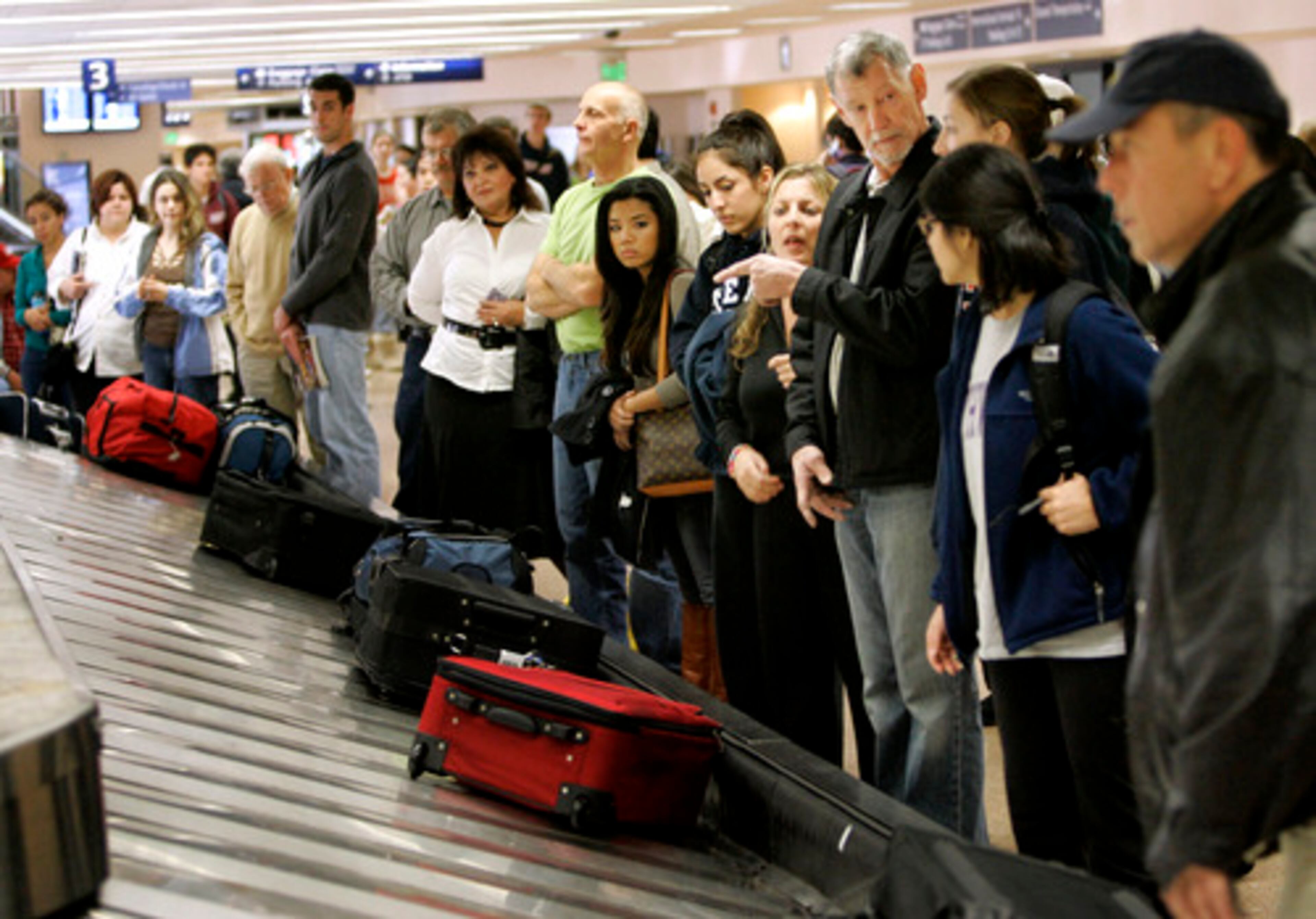 Travelers line up to get their luggage in the Southwest Airlines baggage claim at San Jose International airport in California on Wednesday.