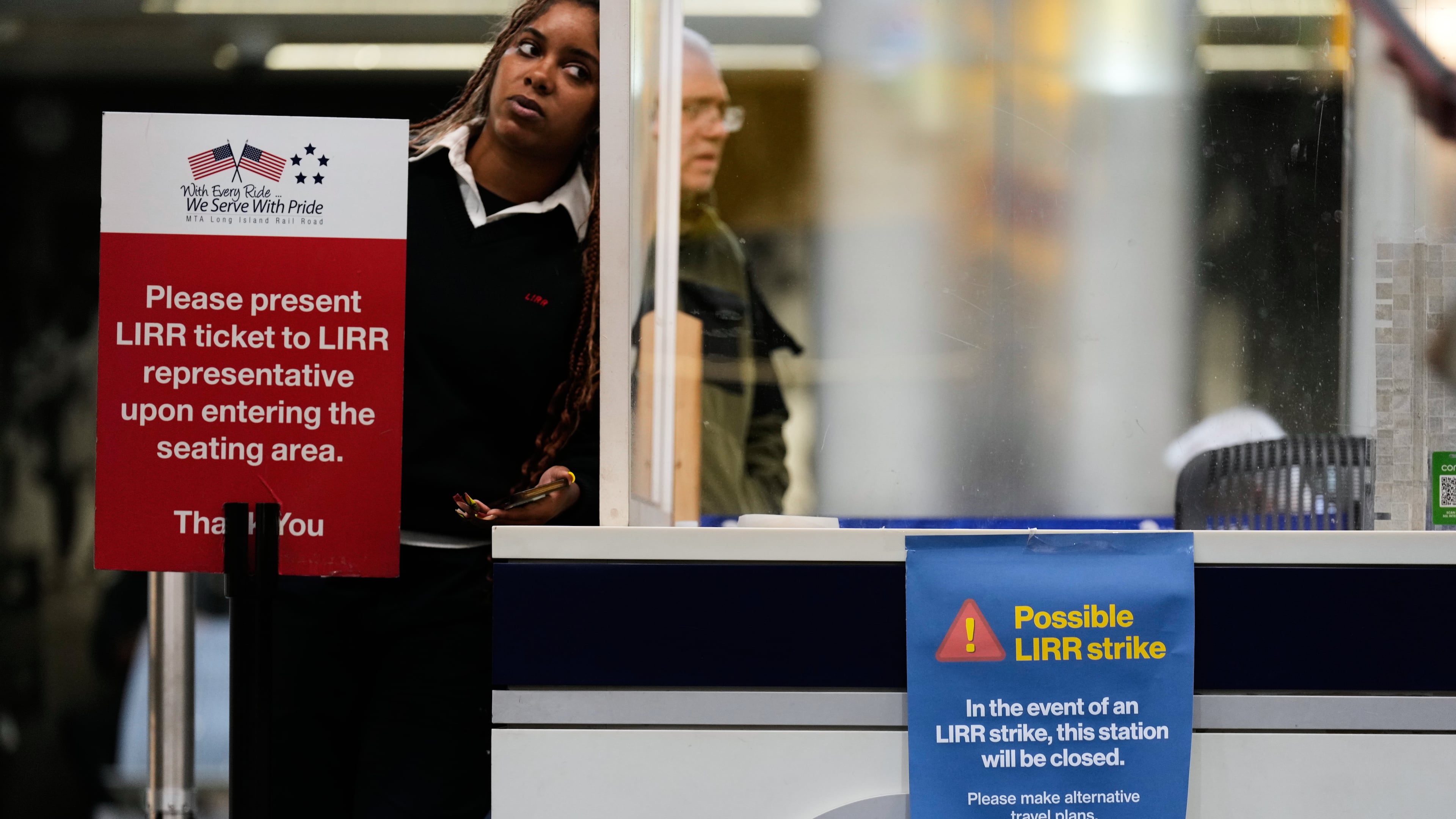 A sign warns commuters of a potential Long Island Rail Road strike at Penn Station in New York, Thursday, May 14, 2026. (AP Photo/Seth Wenig)