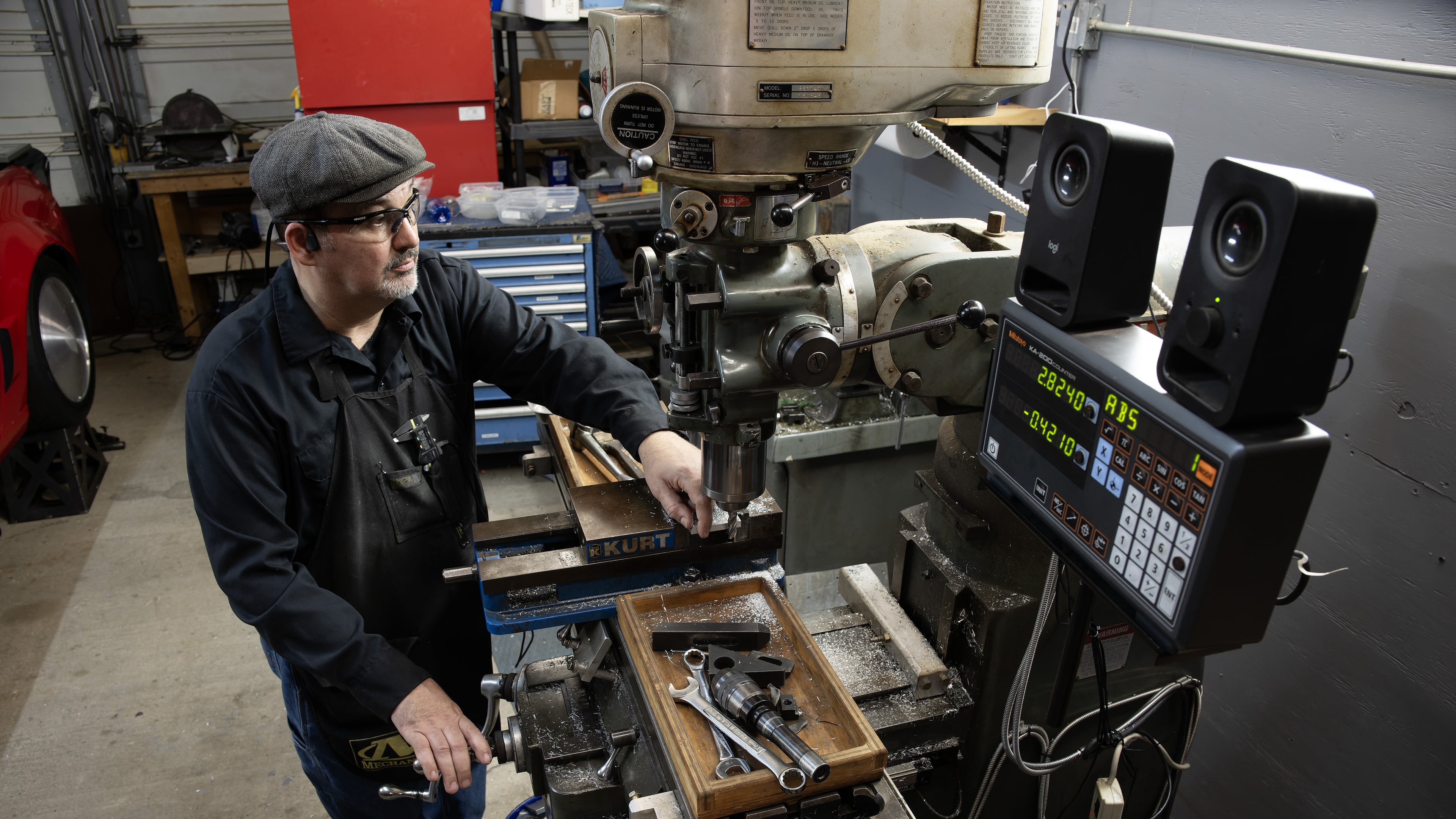 Dan Parker in his Columbus, GA, machine shop. Totally blind following a race car crash in 2013, Parker uses specially adapted tools to create all-metal pens that he sells worldwide. Parker, who attended the Synergies Work EDDIE Awards, was featured in the gala's opening video. He credits the non-profit for helping him grow his business. (Robin Rayne for Zuma Press )