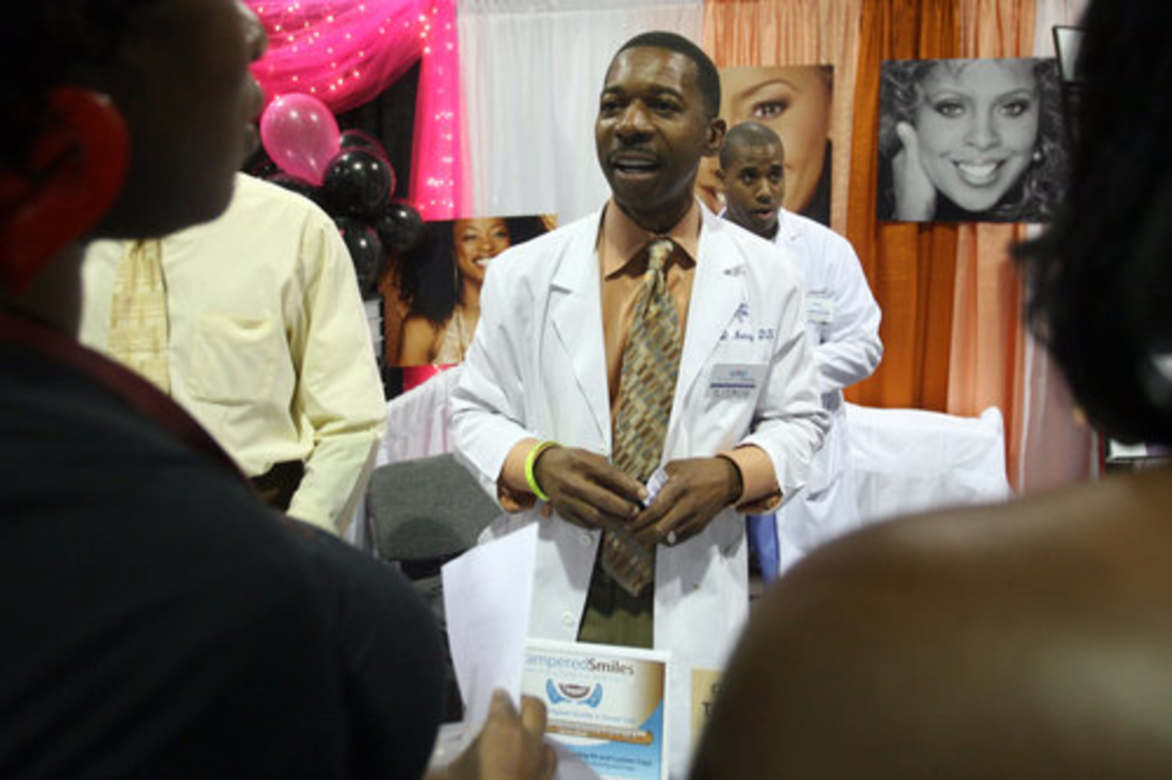 Dr. J. D. Murray, center, discusses oral health. "There is a direct link to diabetes, respiratory and gastrointestinal problems from poor oral health," he said.