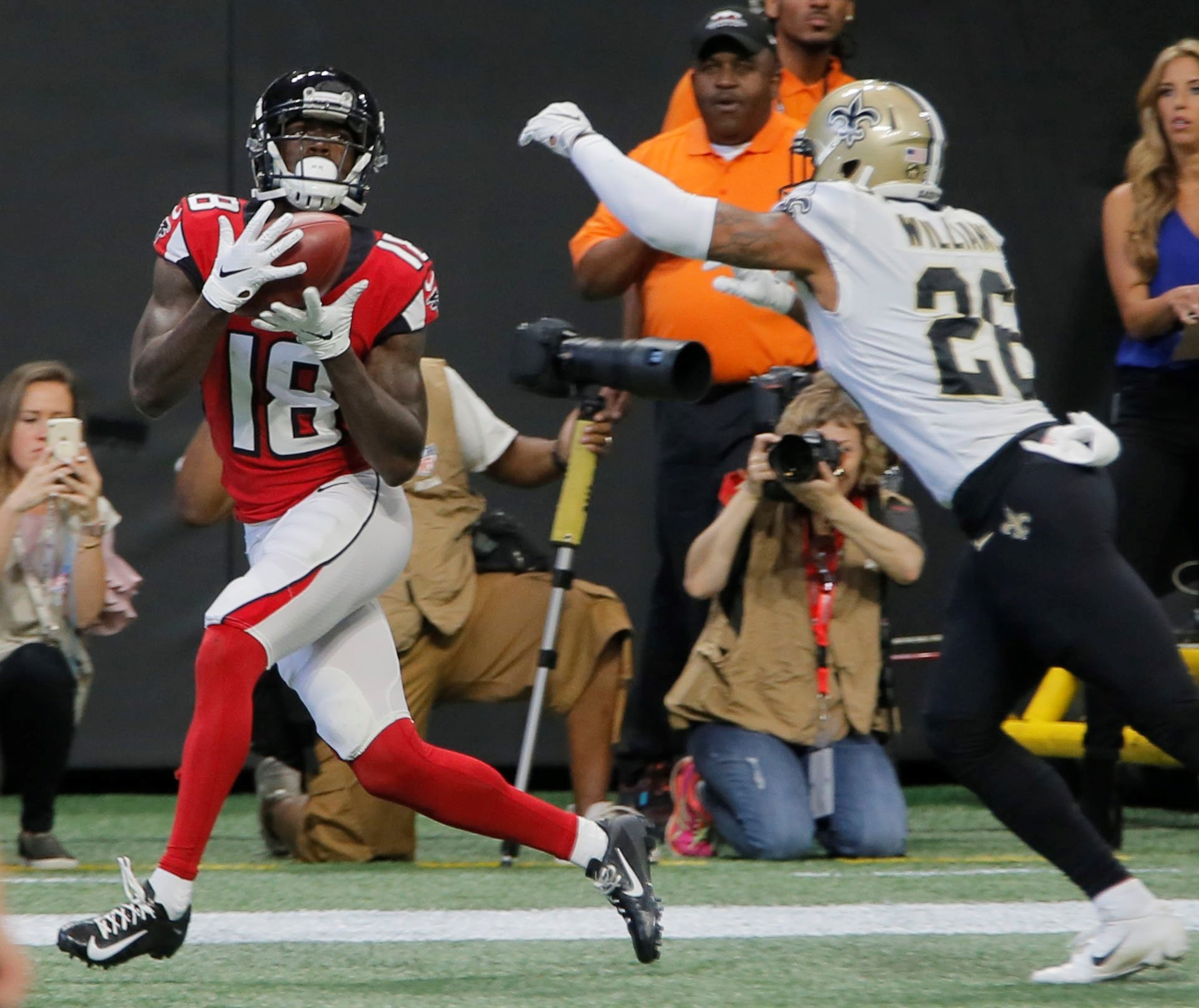 9/23/18 - Atlanta - Atlanta Falcons wide receiver Calvin Ridley (18) scores his first TD of the day in the first half. The Atlanta Falcons played the New Orleans Saints in an NFL football game Sunday, Sept 23, 2018, at Mercedes-Benz Stadium in Atlanta, GA. BOB ANDRES /BANDRES@AJC.COM