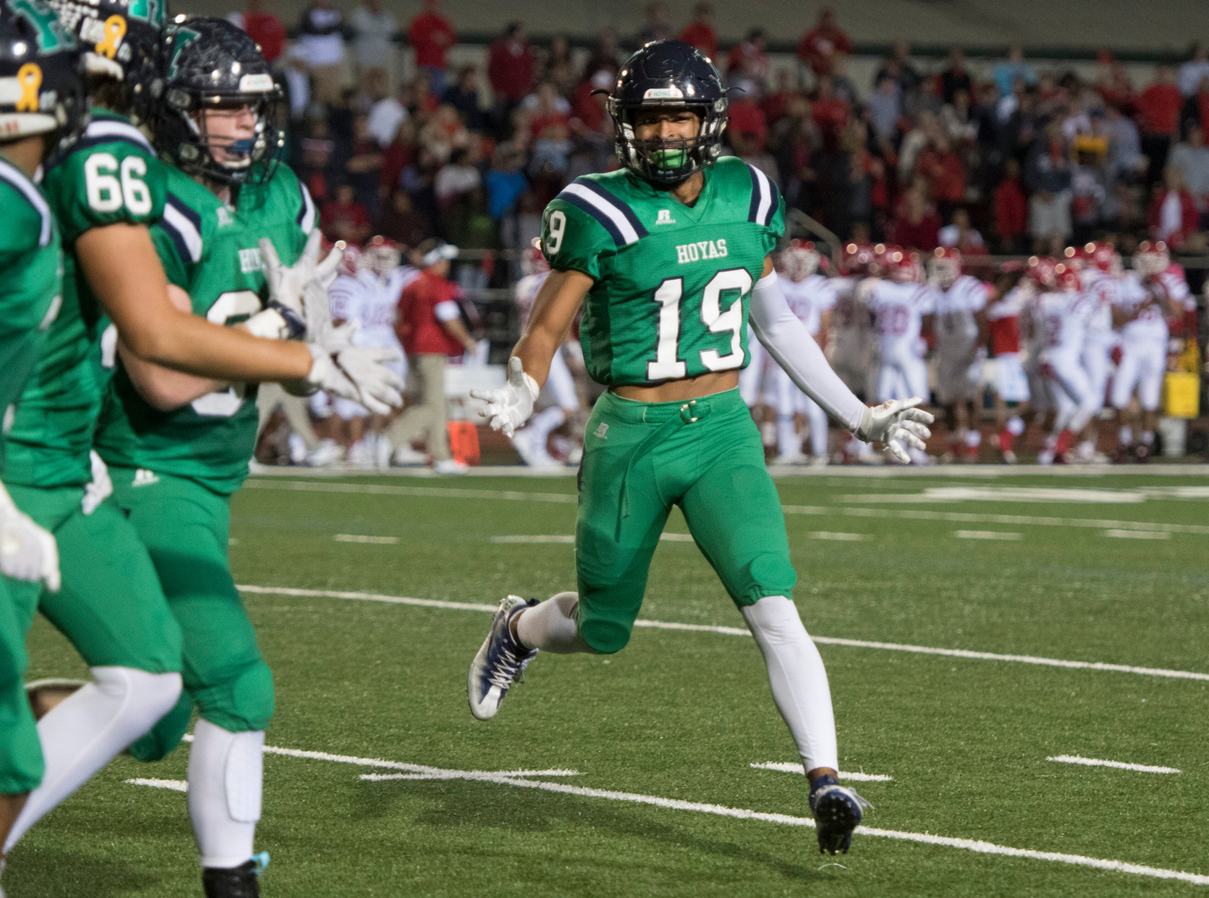 Harrison linebacker Ricky Williams (19) celebrates a blocked extra point attempt against Dalton during a high school football game on Thursday, Oct. 19, 2017, in Kennesaw, Ga. (Special to the Atlanta Journal-Constitution, John Amis )
