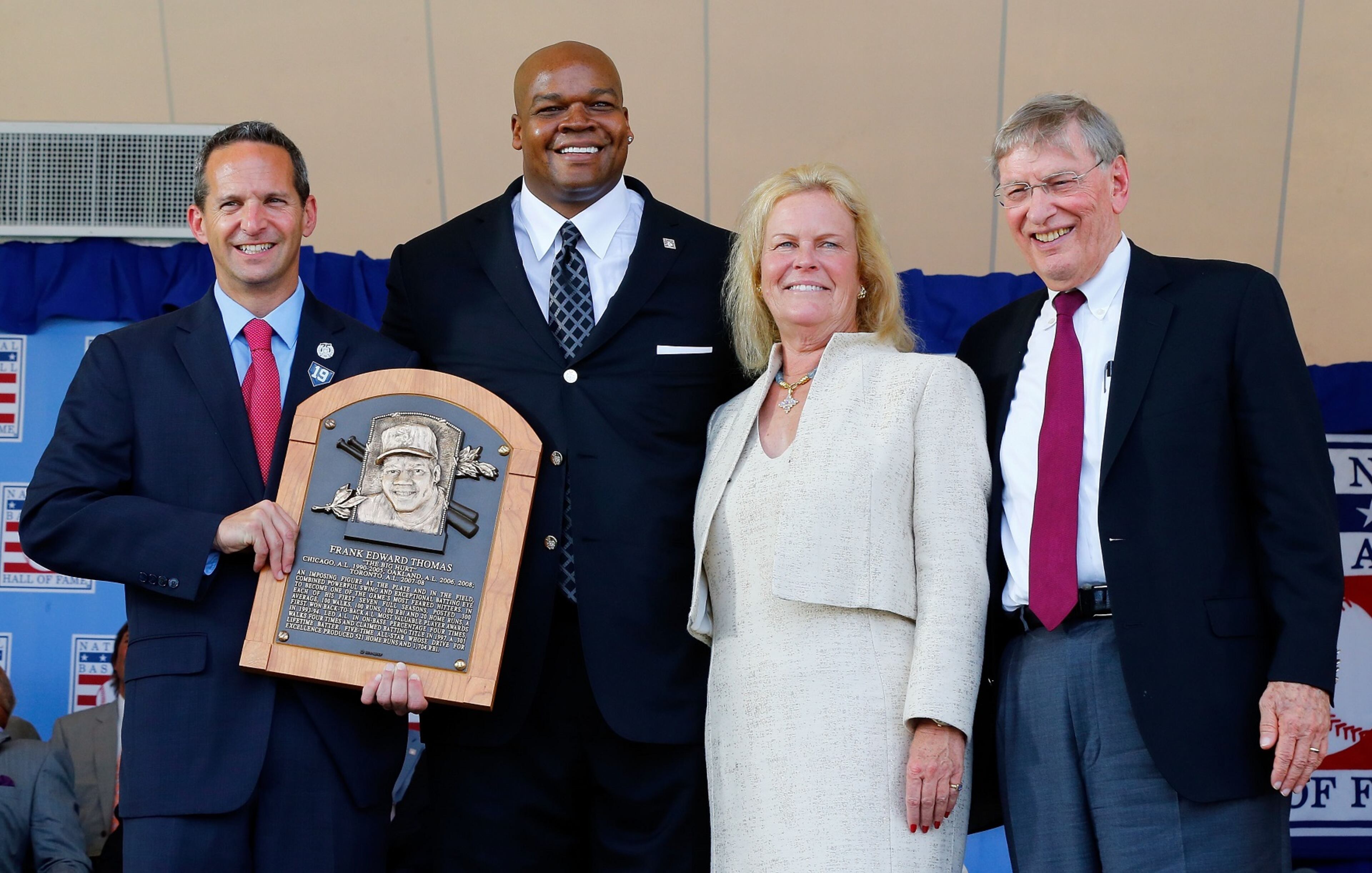 Inductee Frank Thomas (2nd L) poses for a photograph with his plaque with (L-R) Baseball Hall of Fame president Jeff Idelson, Hall of Fame chairperson Jane Forbes Clark and MLB commissioner Bud Selig. (Photo by Jim McIsaac/Getty Images)