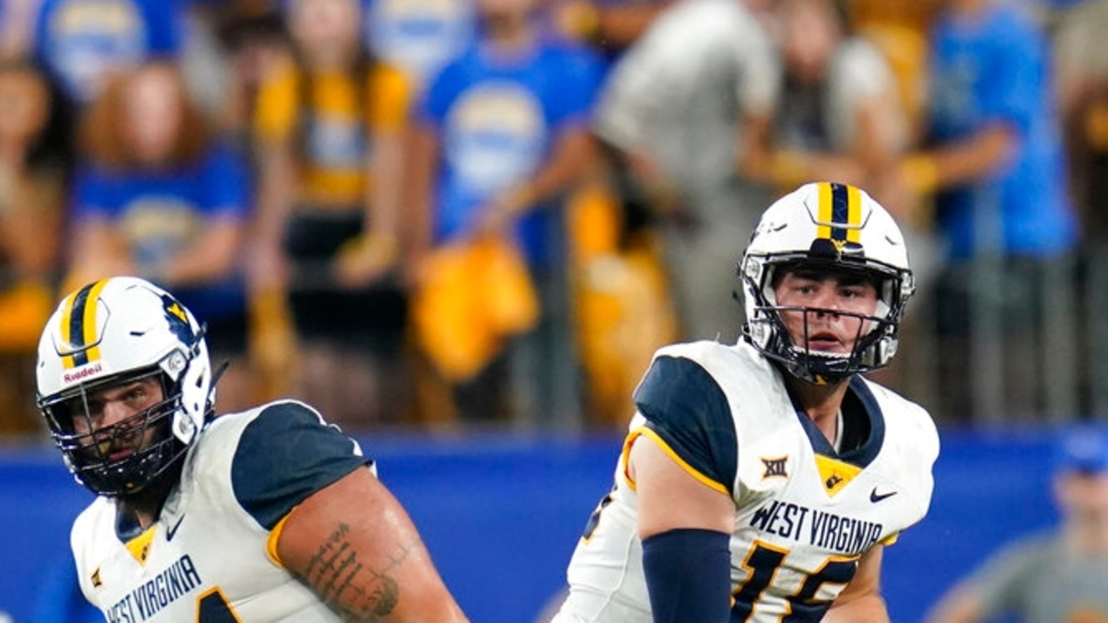 West Virginia quarterback JT Daniels (18) watches a pass against Pittsburgh during the second half of an NCAA college football game Thursday, Sept. 1, 2022, in Pittsburgh. Pittsburgh won 38-31. (AP Photo/Keith Srakocic)