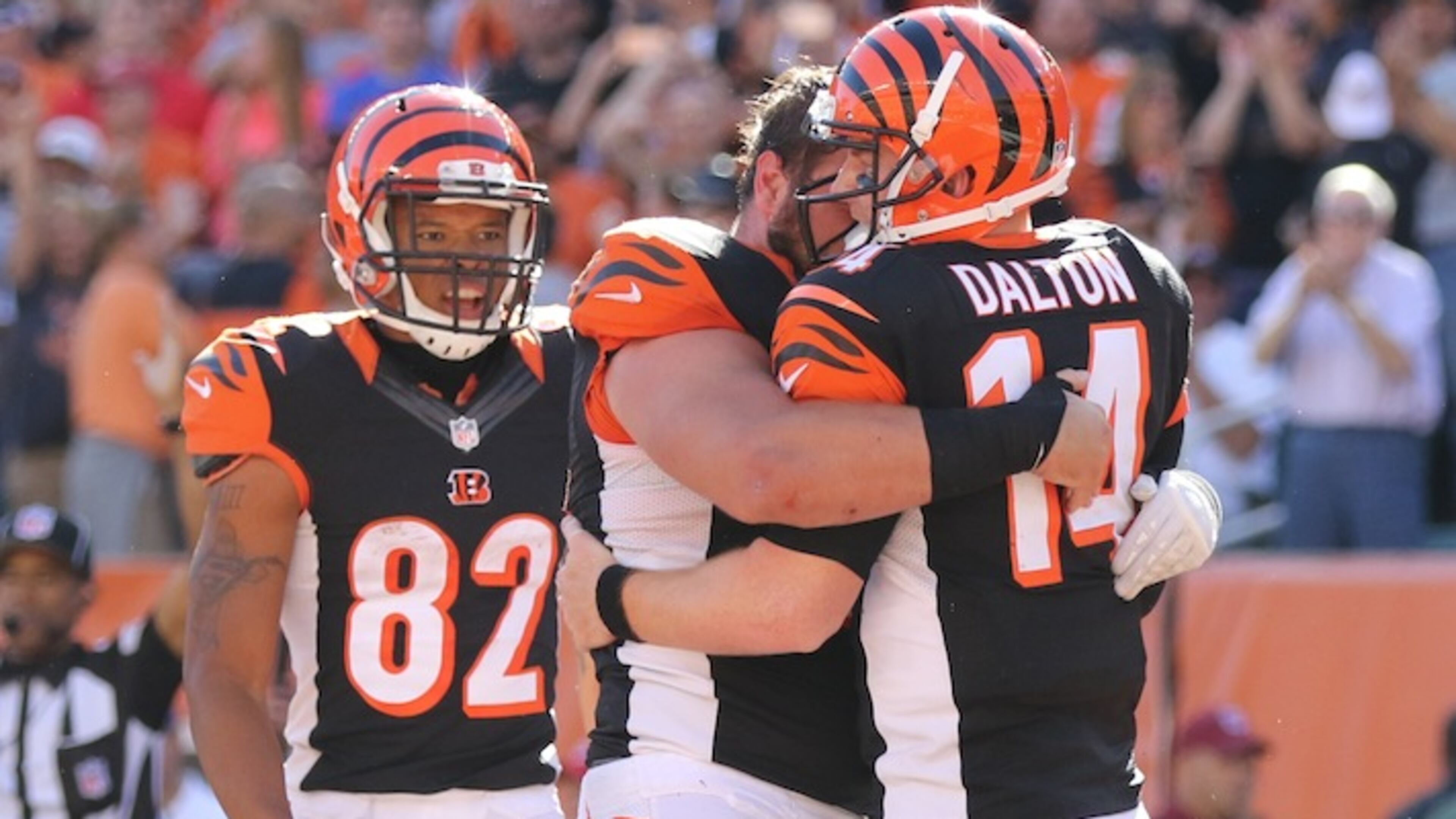 Cincinnati Bengals quarterback Andy Dalton (14) celebrates after scoring a touchdown in the second half of an NFL football game against the Seattle Seahawks, Sunday, Oct. 11, 2015, in Cincinnati. The Bengals won 27-24. (AP Photo/Gary Landers)