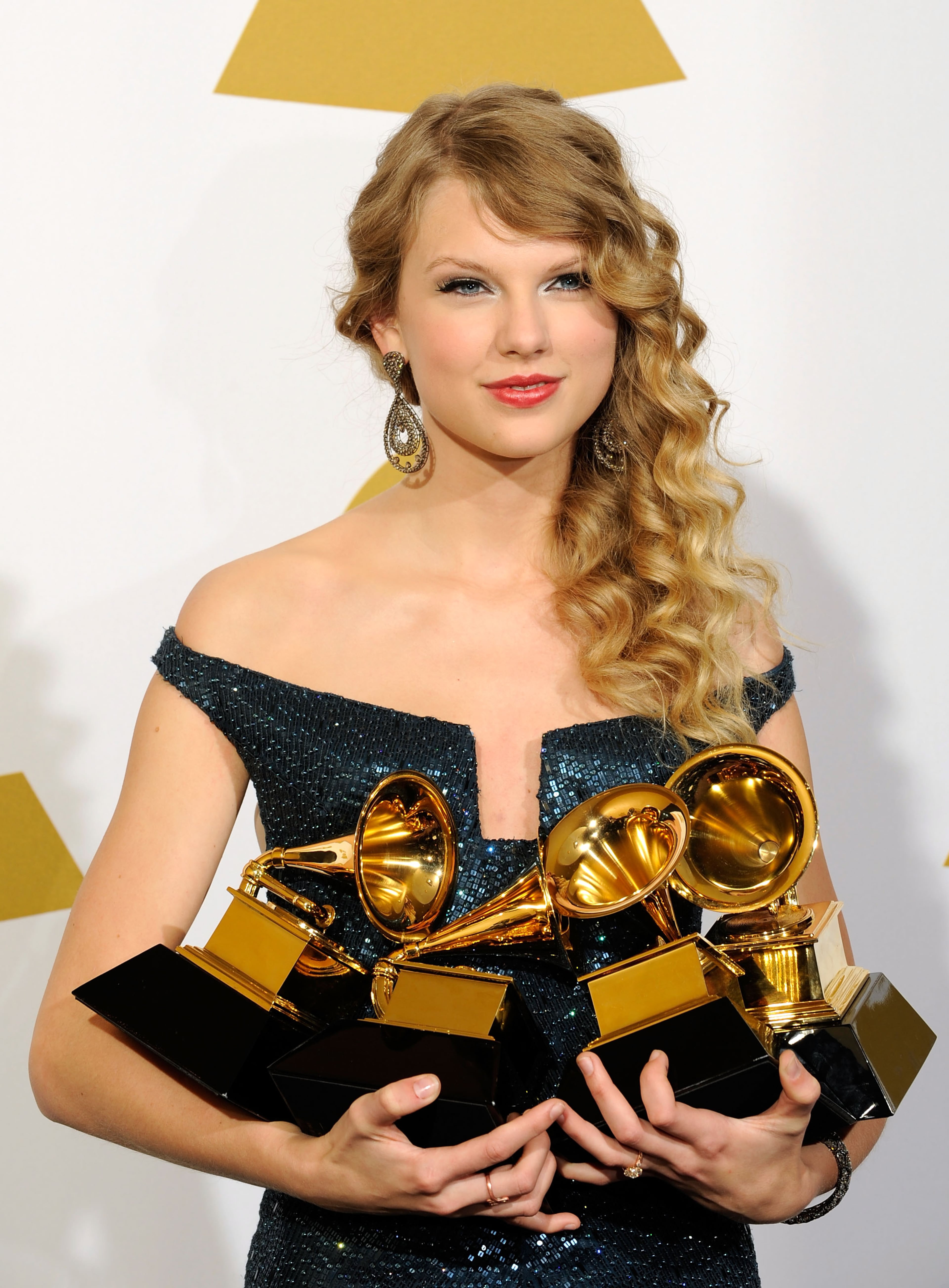 LOS ANGELES, CA - JANUARY 31: Singer Taylor Swift poses with Album Of The Year award for 'Fearless', Best Female Country Vocal Performance for 'White Horse', Best Country Song for 'Fearless' and Best Country Album for 'Fearless' in the press room during the 52nd Annual GRAMMY Awards held at Staples Center on January 31, 2010 in Los Angeles, California. (Photo by Kevork Djansezian/Getty Images)