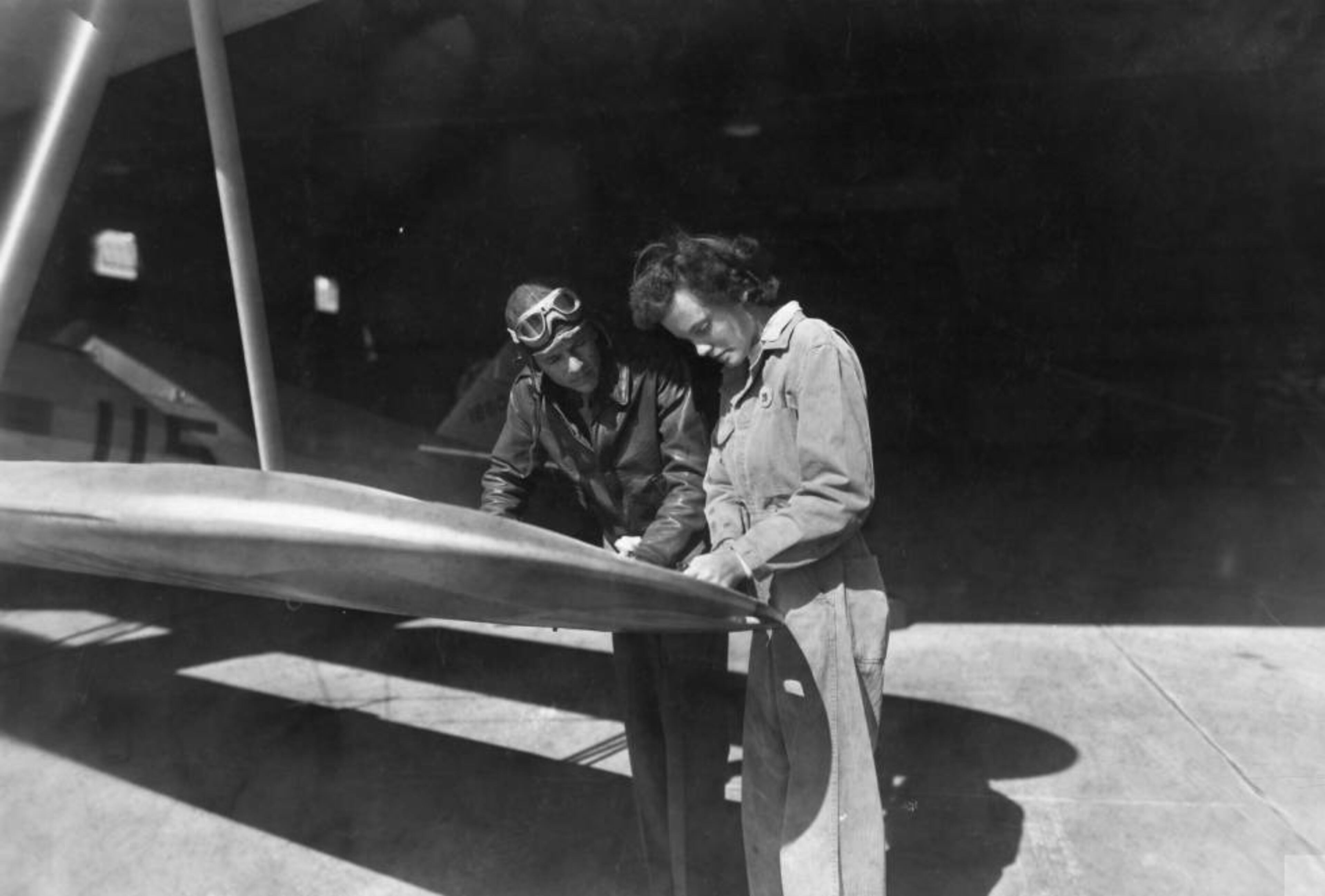 In Douglas, Ga., aircraft technician Emily Ireland appraises the damage done to a wing tap by a 'ground loop' while the cadet pilot anxiously awaits the verdict. AJC file