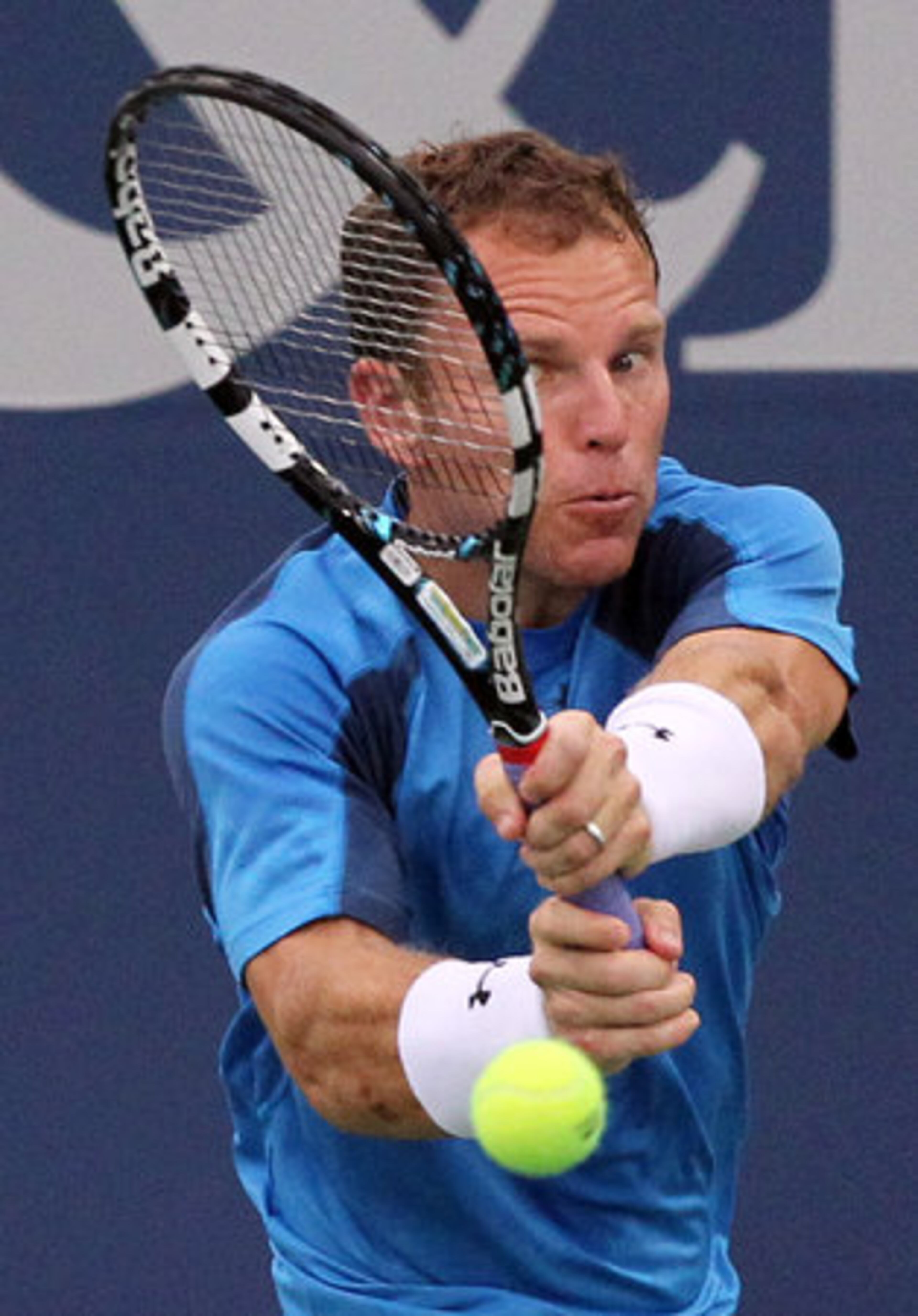 Michael Russell (USA) hits a shot to Andy Roddick (USA) during quarterfinals play in the Atlanta Open on Friday, July 20, 2012.