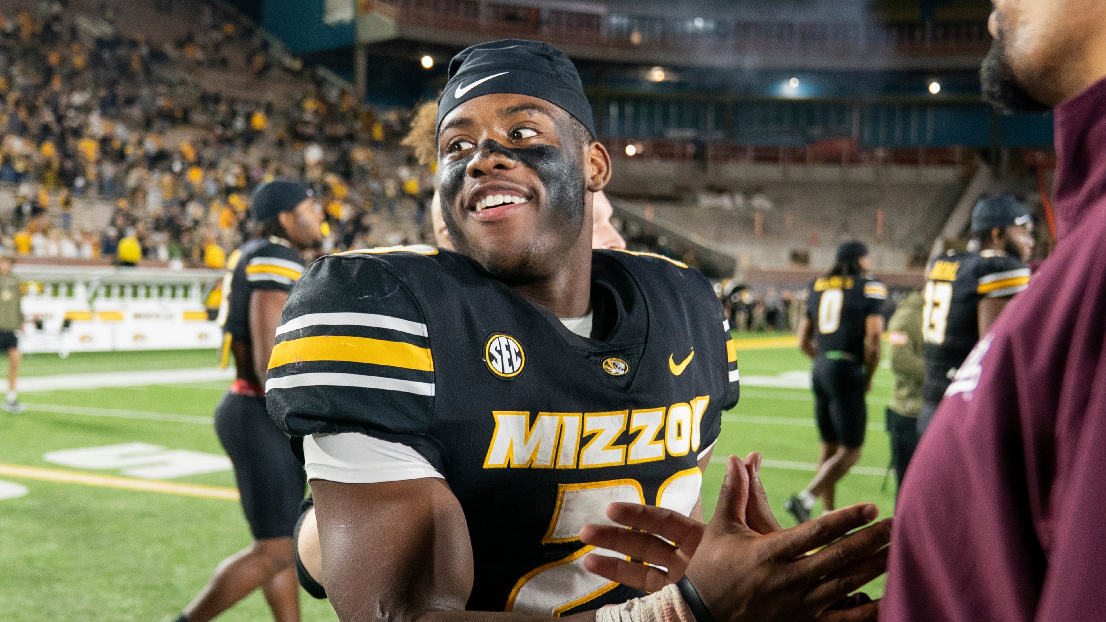 Missouri running back Ahmad Hardy, left, is congratulated after his team defeated Mississippi State in an NCAA college football game Nov. 15, 2025, in Columbia, Mo. (AP Photo/L.G. Patterson)