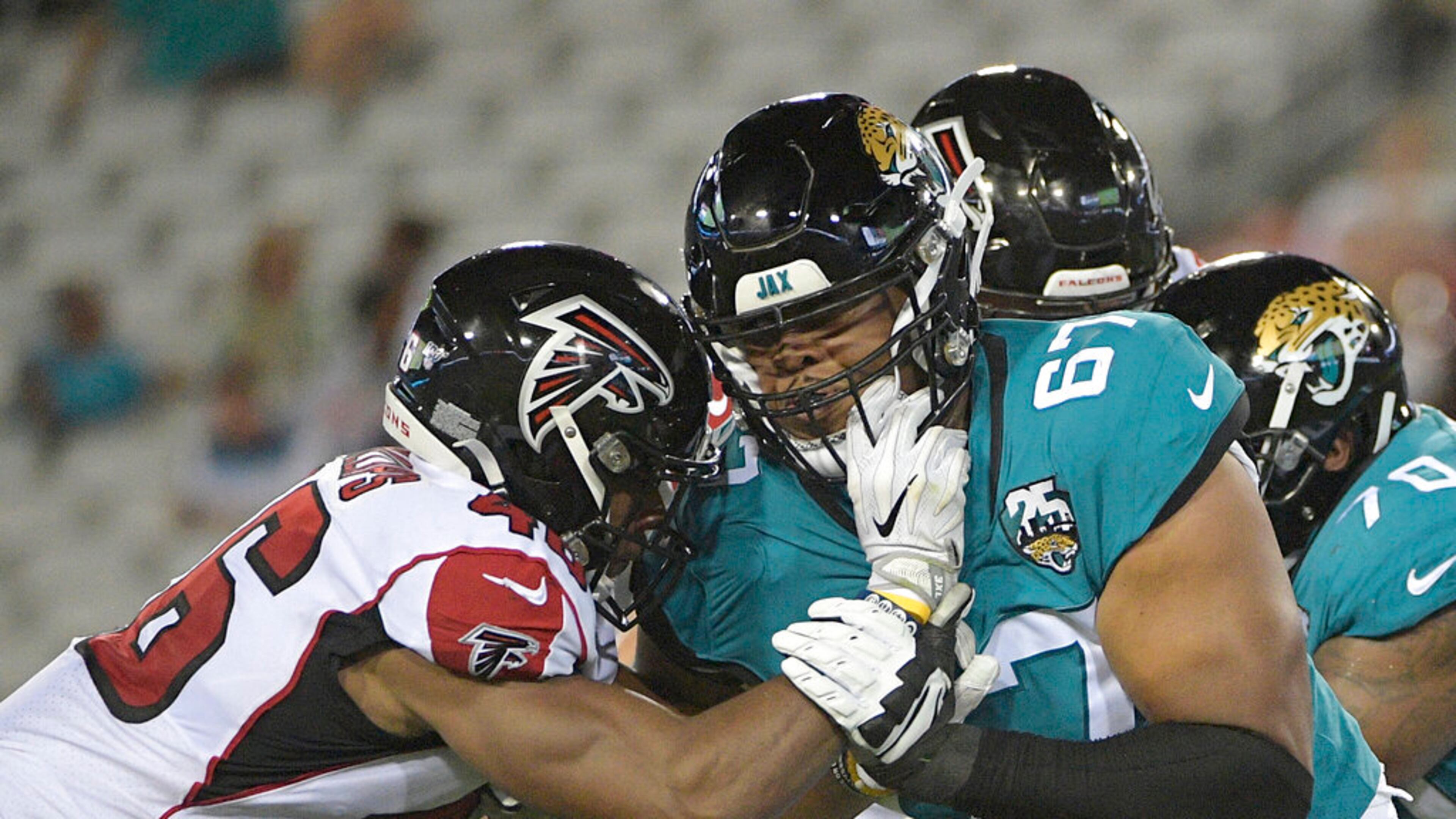 Jacksonville Jaguars offensive tackle Ka'John Armstrong (right) blocks against the Falcons in a NFL preseason football game on Thursday, Aug. 29, 2019, in Jacksonville, Fla. (AP Photo/Phelan M. Ebenhack)