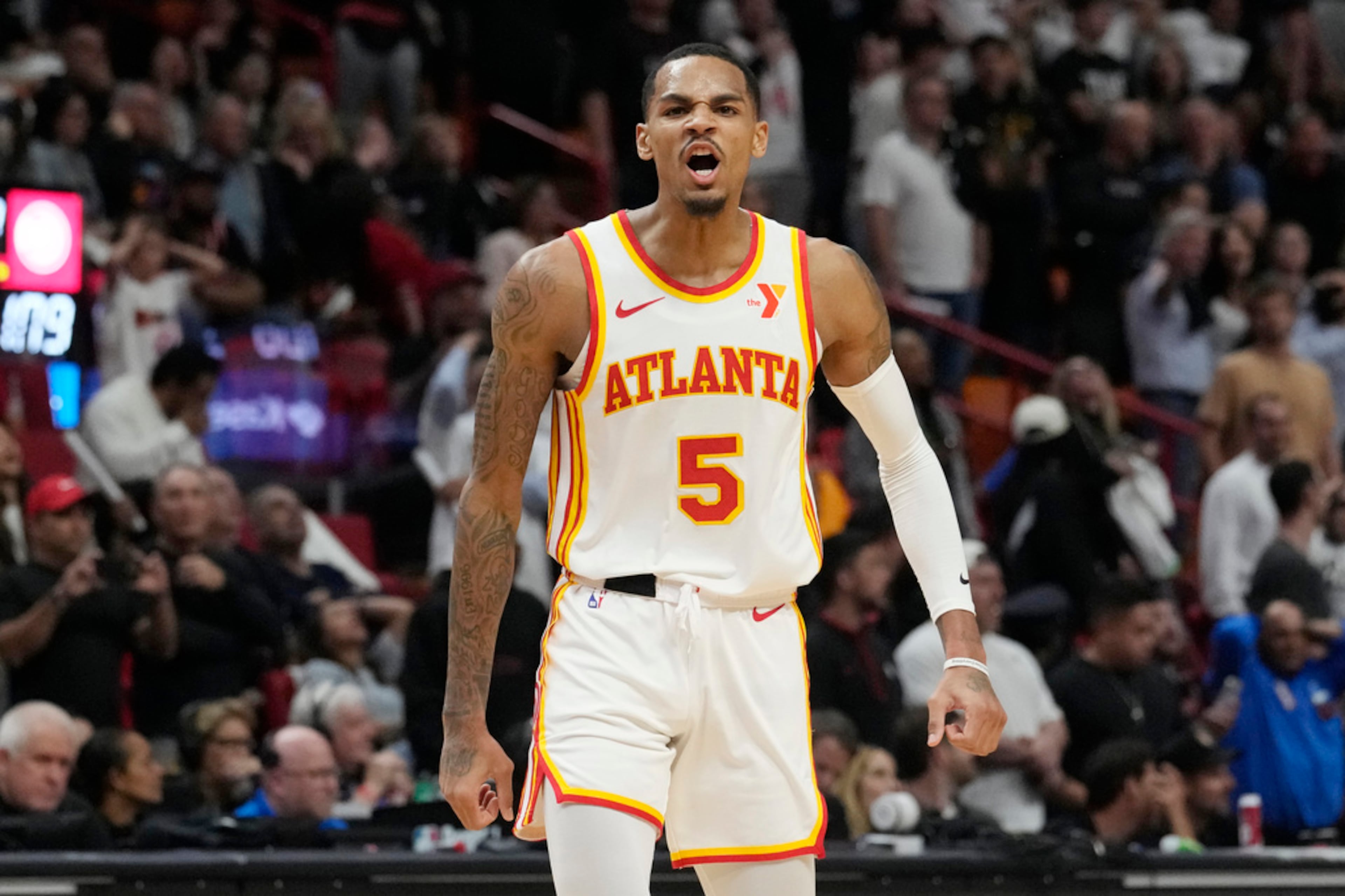 Atlanta Hawks guard Dejounte Murray (5) reacts after scoring the game winning basket during the second half of an NBA basketball game against the Miami Heat, Friday, Jan. 19, 2024, in Miami. Murray hit a shot with two seconds left to play to lift the Hawks to a 109-108 victory. (AP Photo/Marta Lavandier)