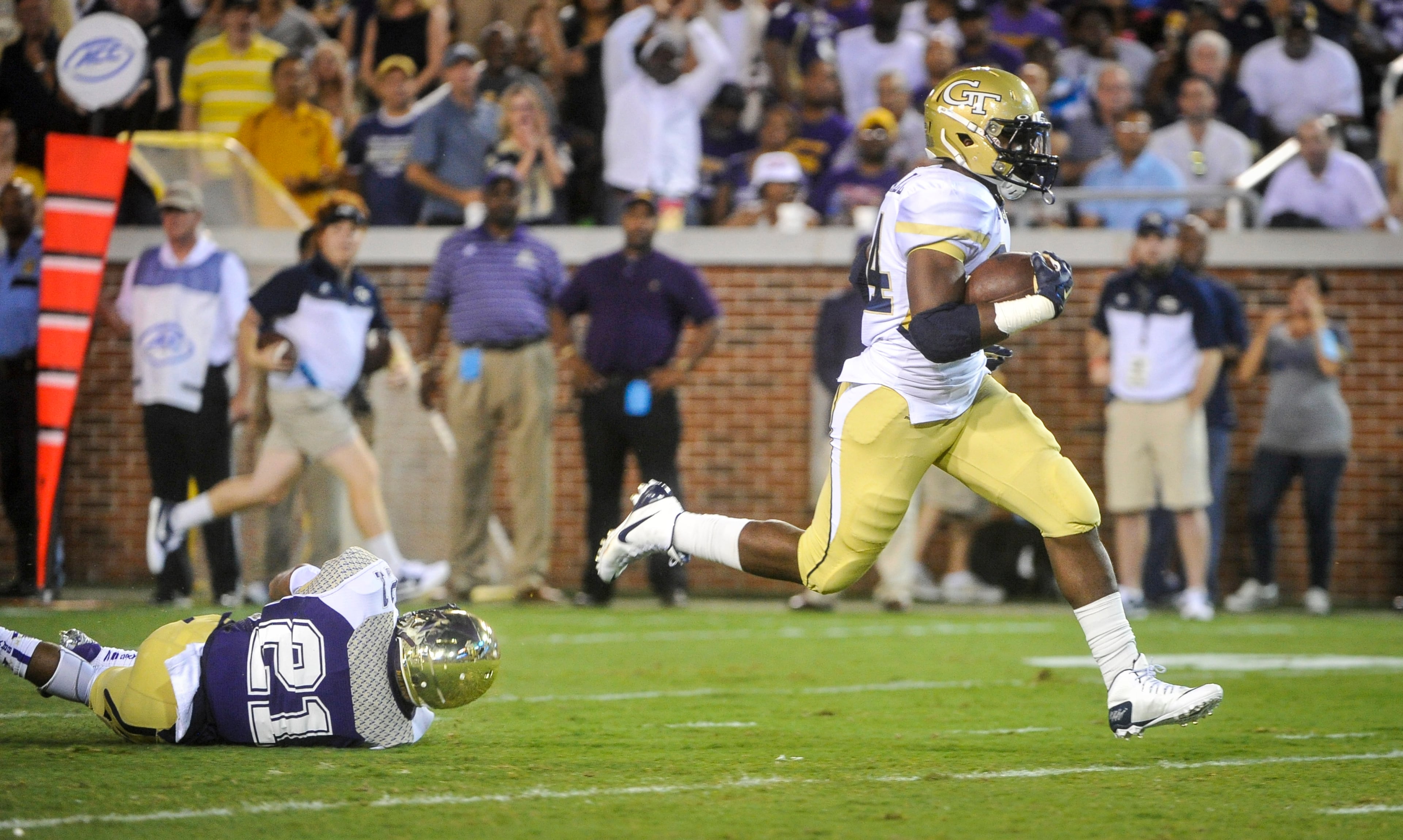 Georgia Tech running back Marcus Marshall (34) gets away from Alcorn State defensive back Quinton Cantue (21) as he runs for a touchdown during the first quarter on Thursday, Sept. 3, 2015. (AP Photo/John Amis)