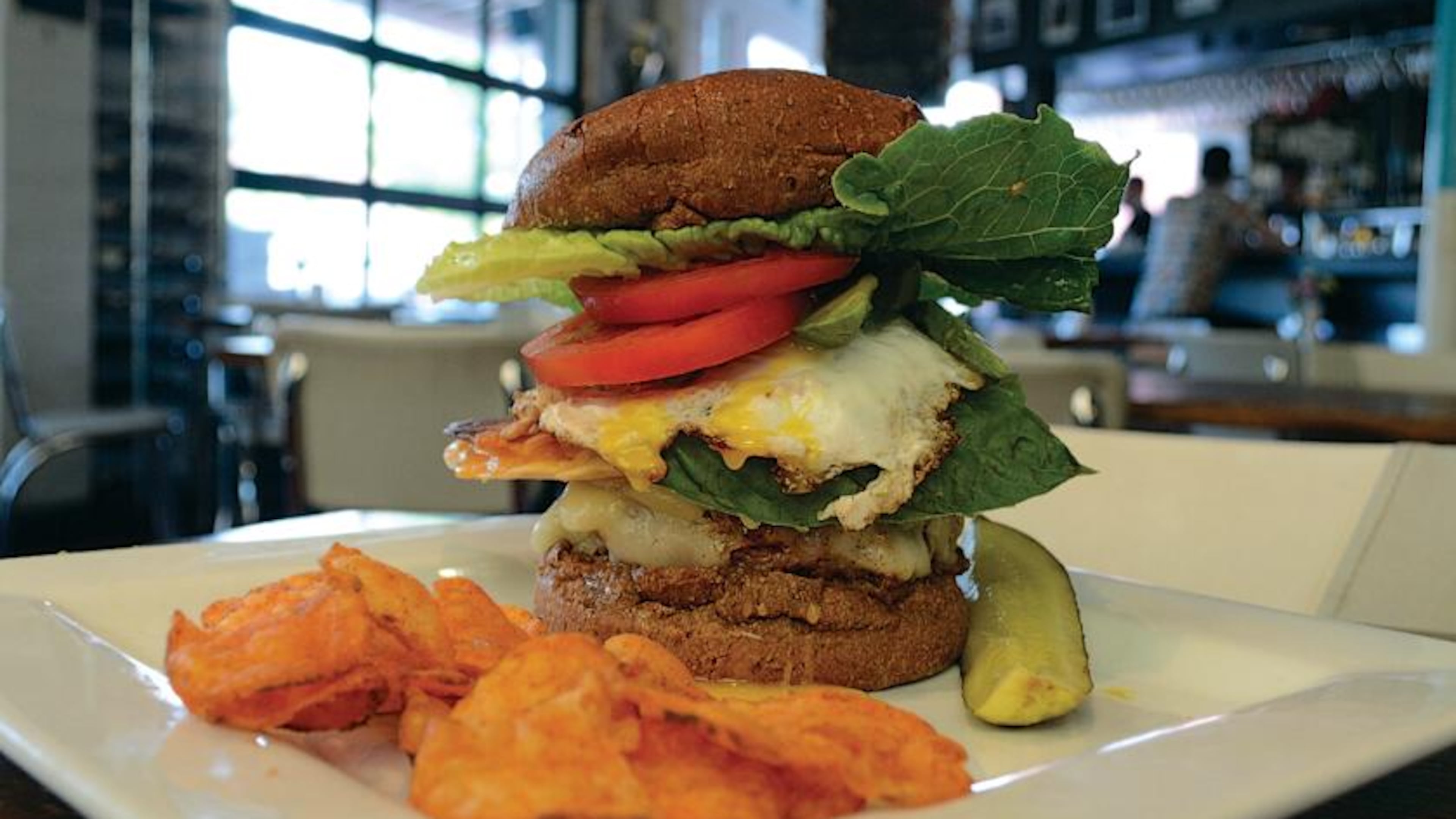 Local Republic serves up craft beer and creative burgers, like "The Sink," which which starts with a sunny side up egg, plus whatever else the kitchen wants to add on. PHOTO CREDIT: Ben Bailey