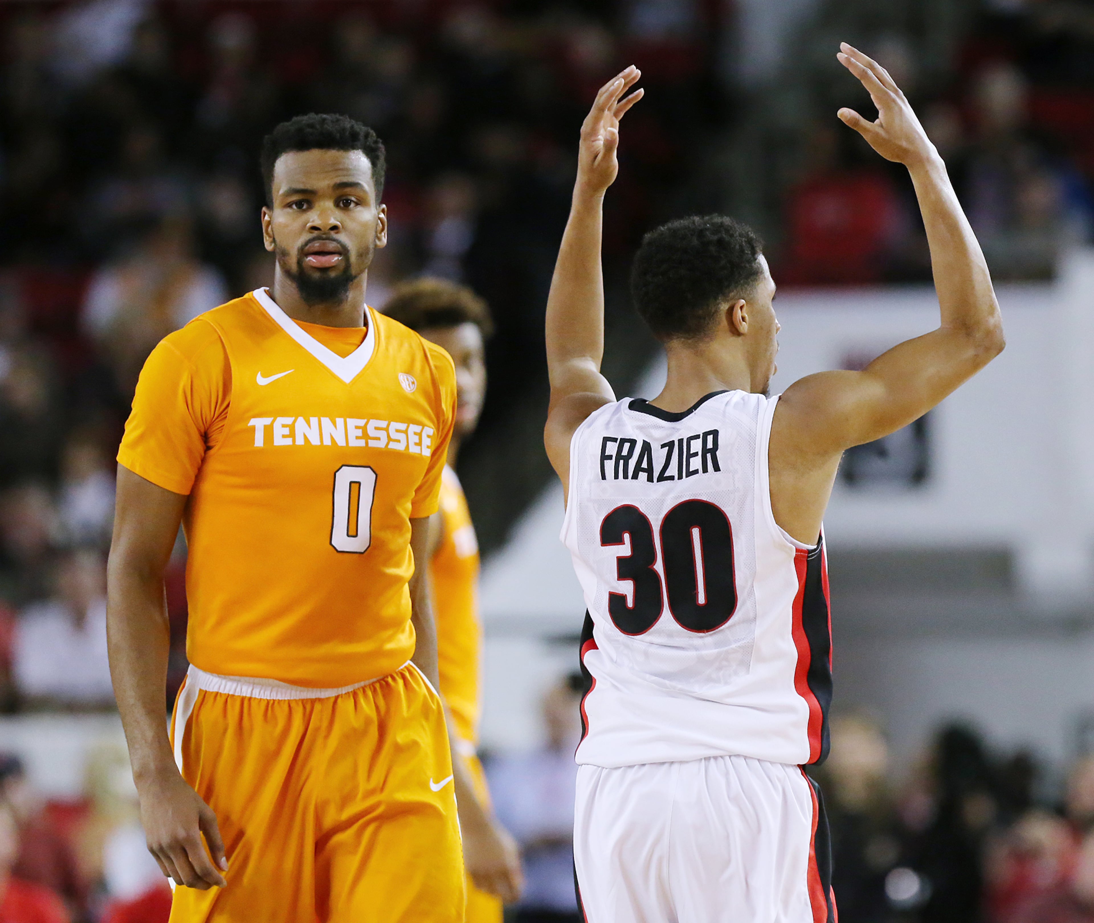 reacts to the crowd after scoring against Tennessee while Kevin Punter (left) walks away in a basketball game on Wednesday, Jan. 13, 2016, in Athens. Georgia beat Tennessee 81-72. Curtis Compton / ccompton@ajc.com