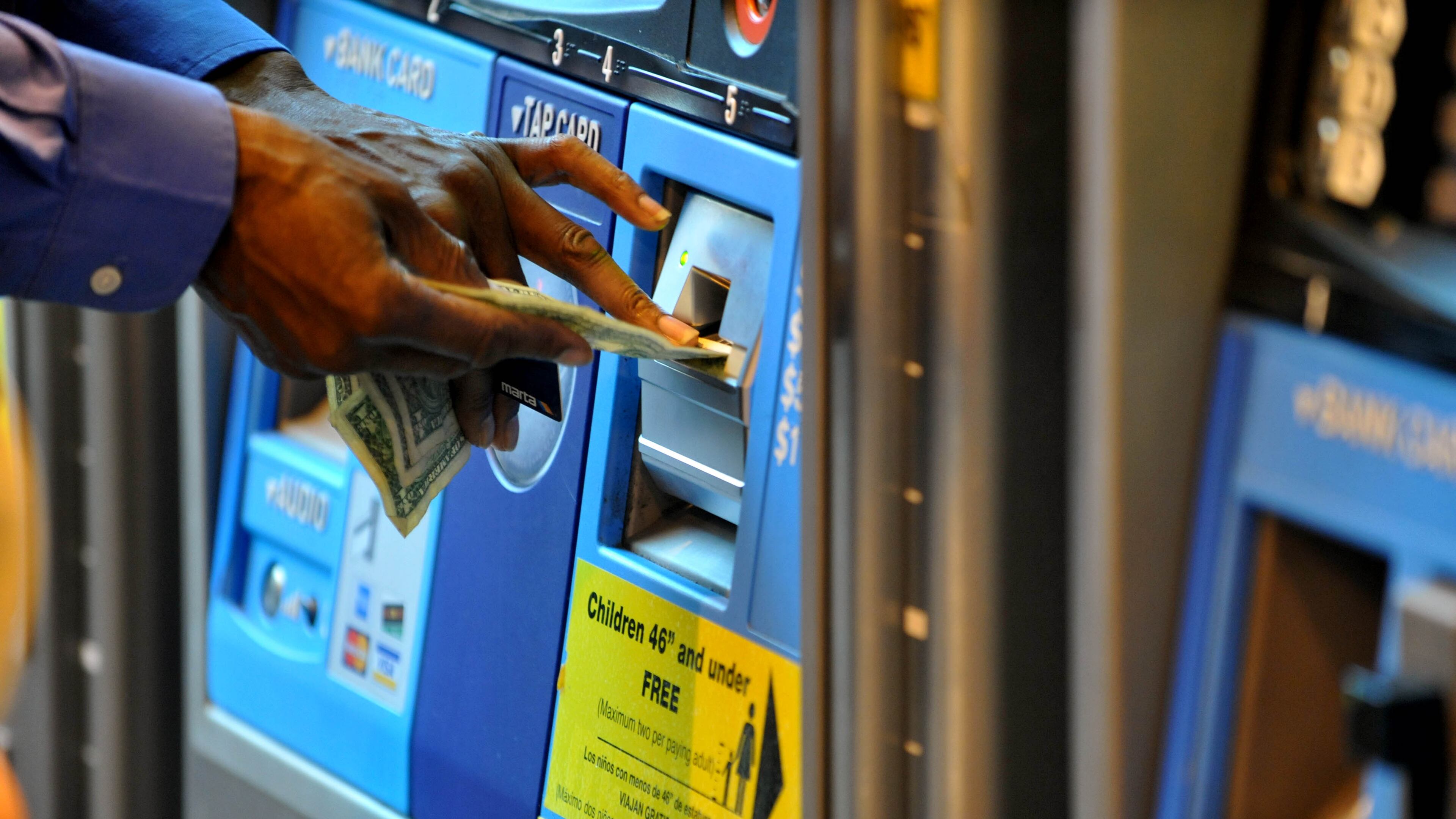 Patrons using fare machines at the Hartsfield Jackson International Airport MARTA station on Tuesday September 4, 2012. KENT D. JOHNSON / KDJOHNSON@AJC.COM