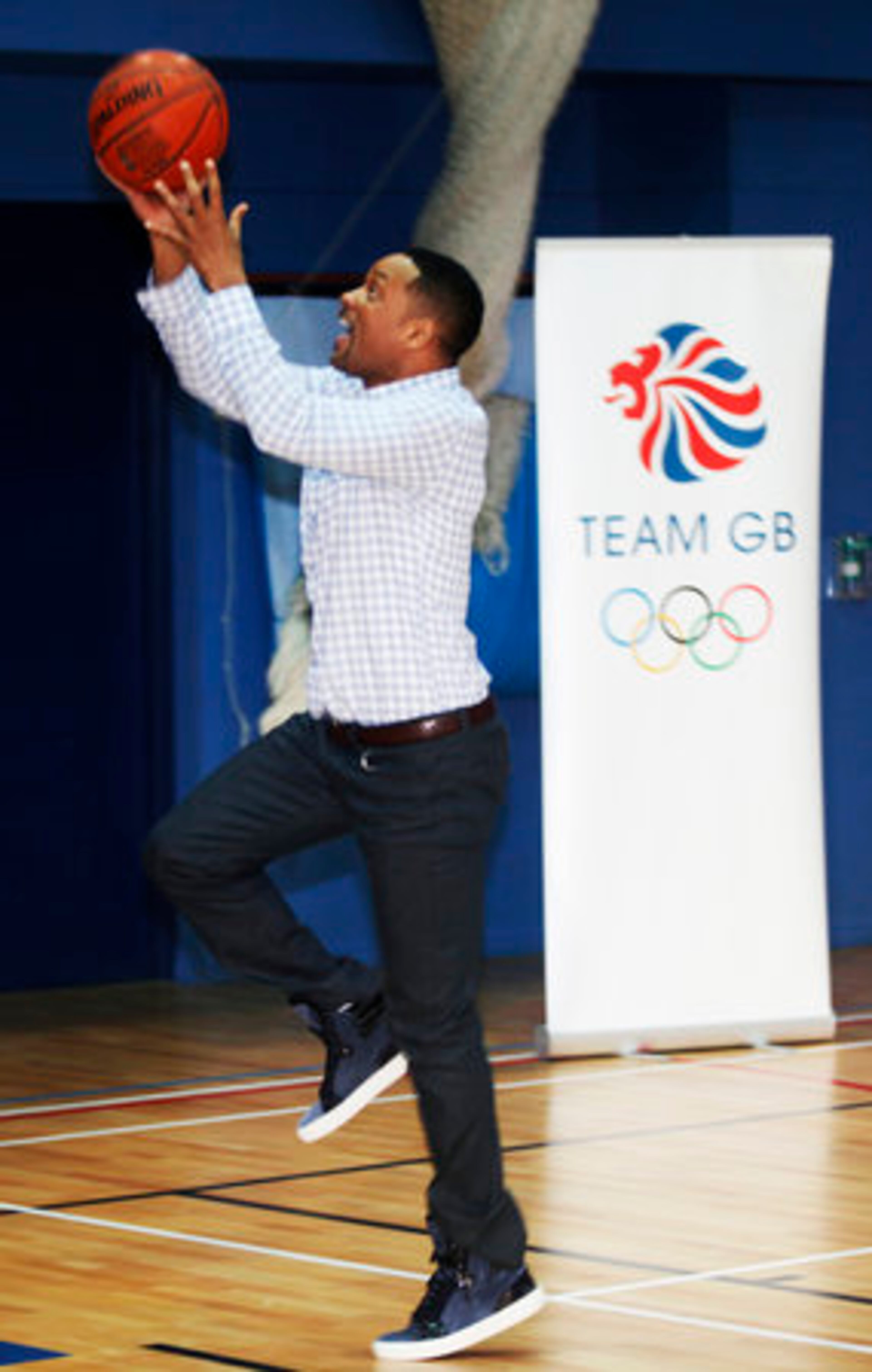 Will Smith, who says he has "never been really athletic," goes for a layup.