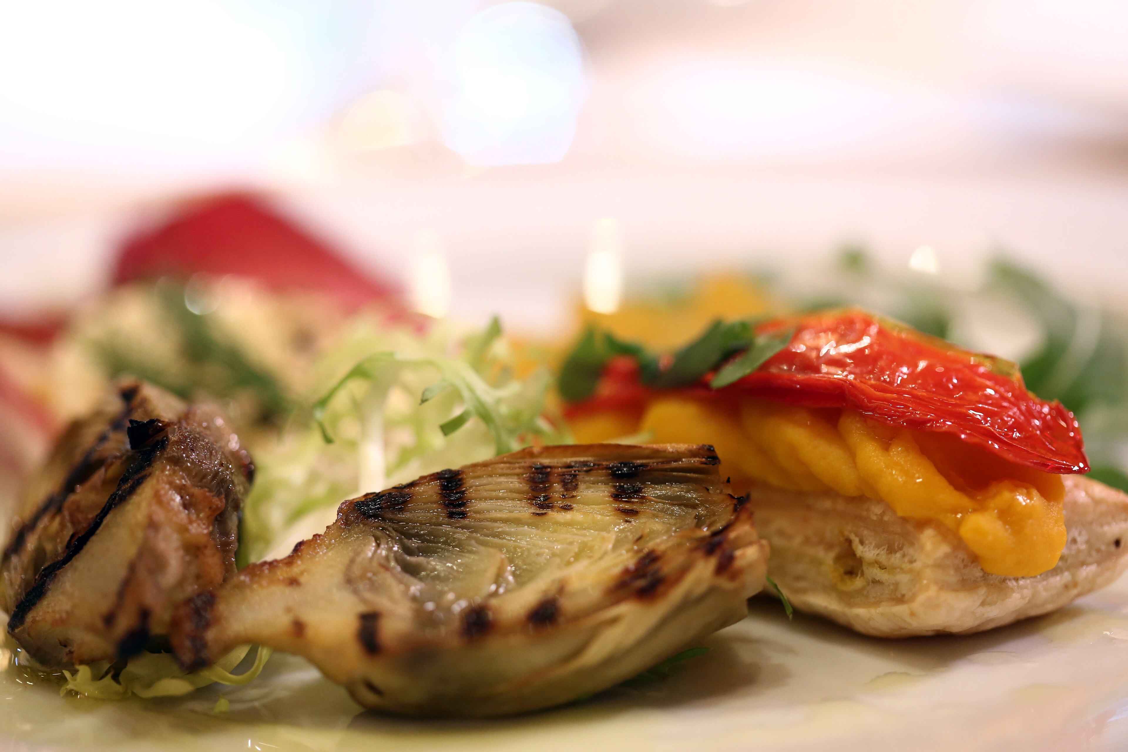 The appetizer dish of grilled artichoke with fennel tomato lemon mousse and California pepper honey goat cheese on endive pear salad is seen during the menu preview for the 70th annual Golden Globe awards at the Beverly Hilton Hotel on Thursday, Jan. 3, 2013, in Beverly Hills, Calif. The Golden Globes will be held Sunday, Jan 13.