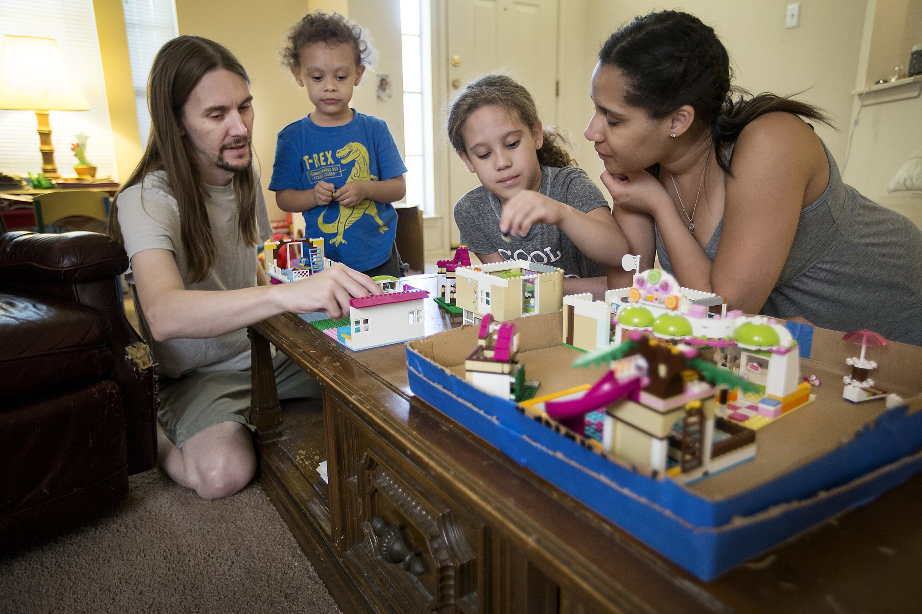 The Guess family enjoys playing with building blocks together. The Guess Family has multiple medical concerns. Father Shawn Guess has a brain tumor; mother Megan Guess has Common Variable Immune Deficiency; daughter Kylie, 9, has juvenile arthritis; and son Carl, 3, has a speech delay.