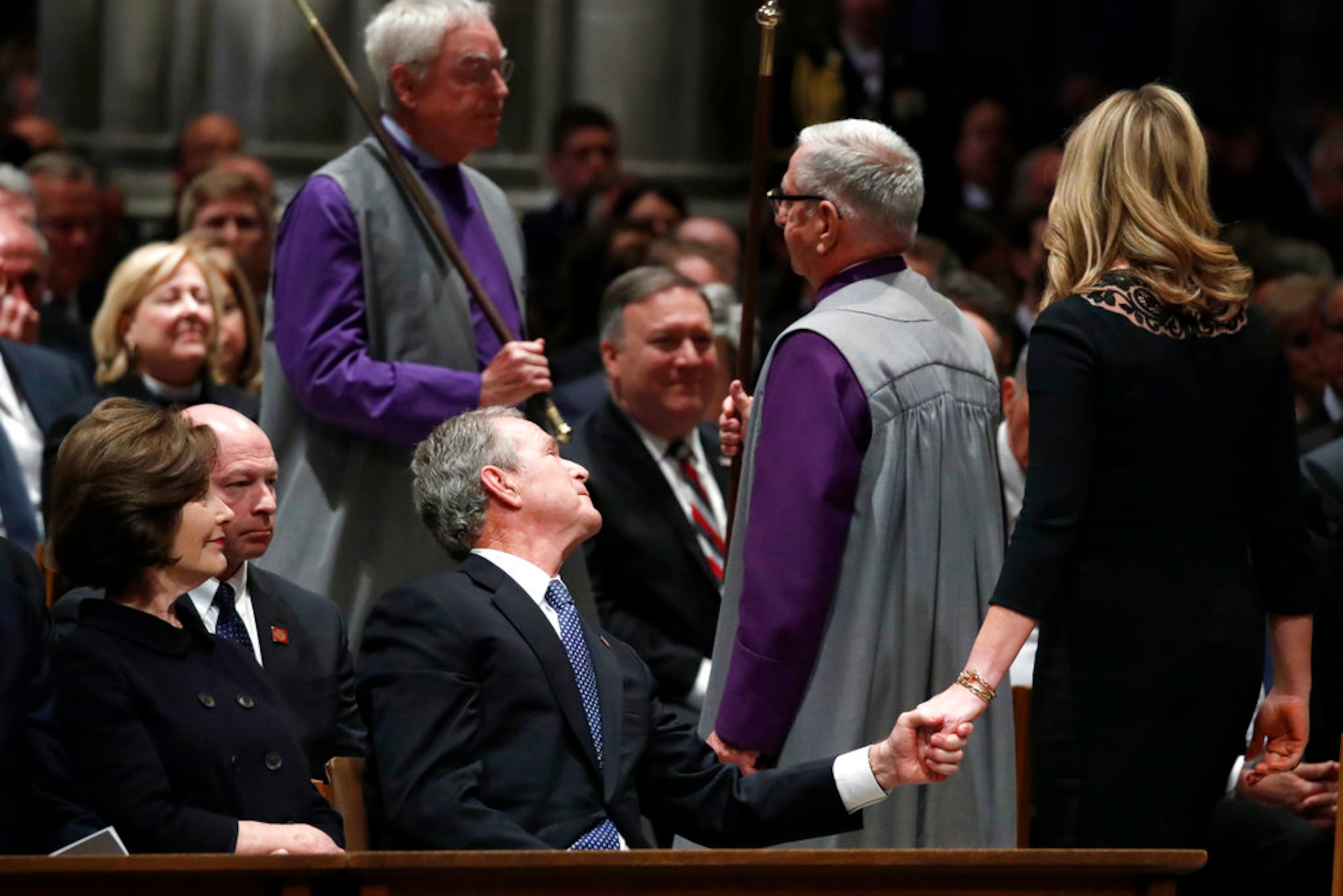 Former President George Bush clasps hands with his daughter Jenna Bush Hager after she spoke during the State Funeral for former President George H.W. Bush at the National Cathedral, Wednesday, Dec. 5, 2018, in Washington. (AP Photo/Alex Brandon, Pool)