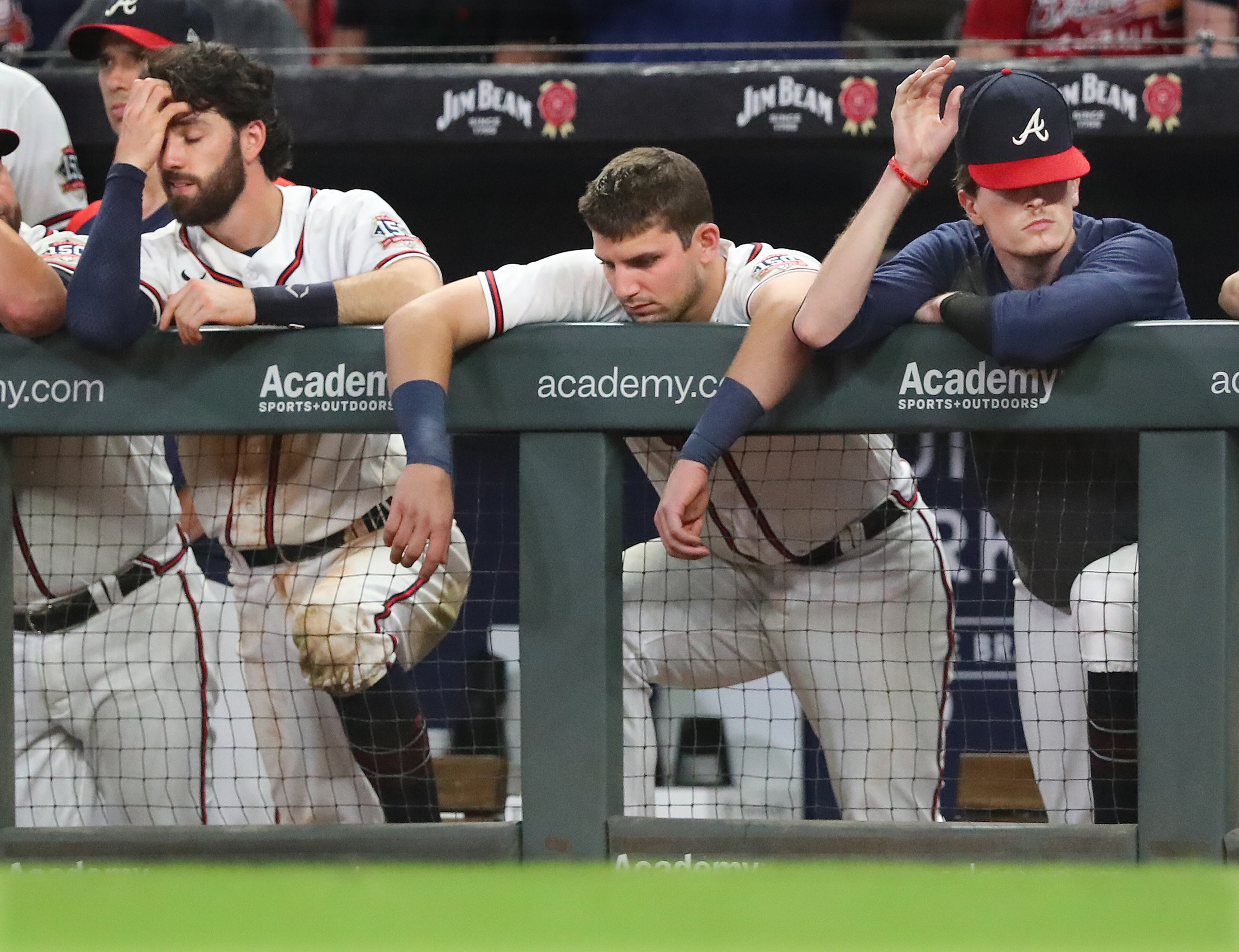 Braves players (from left) Dansby Swanson, Austin Riley, and Max Fried react in the dugout during the final three outs against the Washington Nationals during the ninth inning in a 4-2 loss on Wednesday, Sept 8, 2021, in Atlanta. “Curtis Compton / Curtis.Compton@ajc.com”