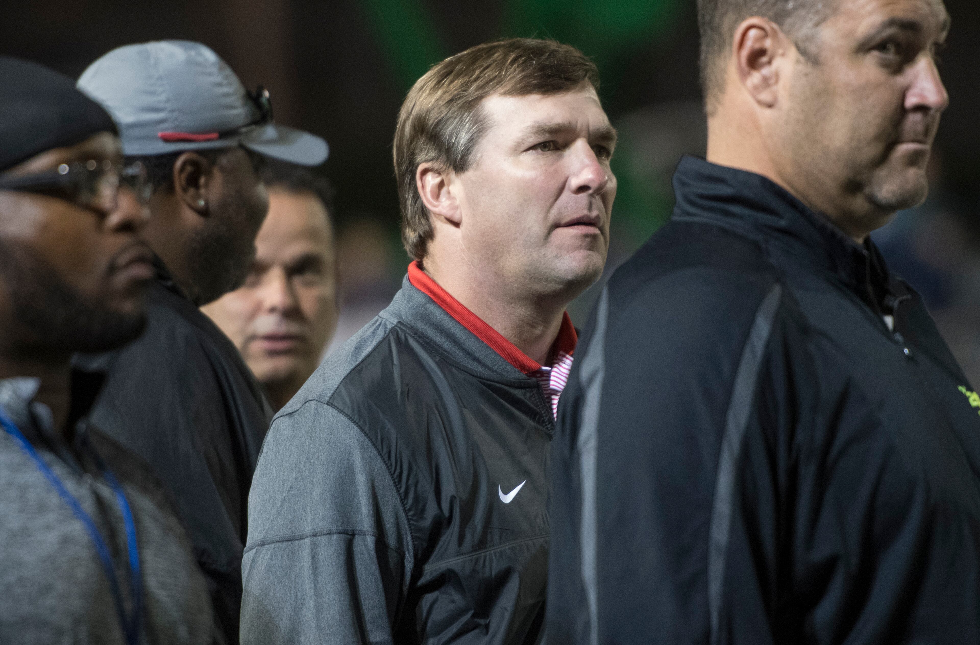 Georgia head coach Kirby Smart, center, watches from the sideline during a high school football game pitting Harrison and Dalton on Thursday, Oct. 19, 2017, in Kennesaw, Ga. Harrison quarterback Justin Fields has committed to play for Georgia. (Special to the Atlanta Journal-Constitution, John Amis )