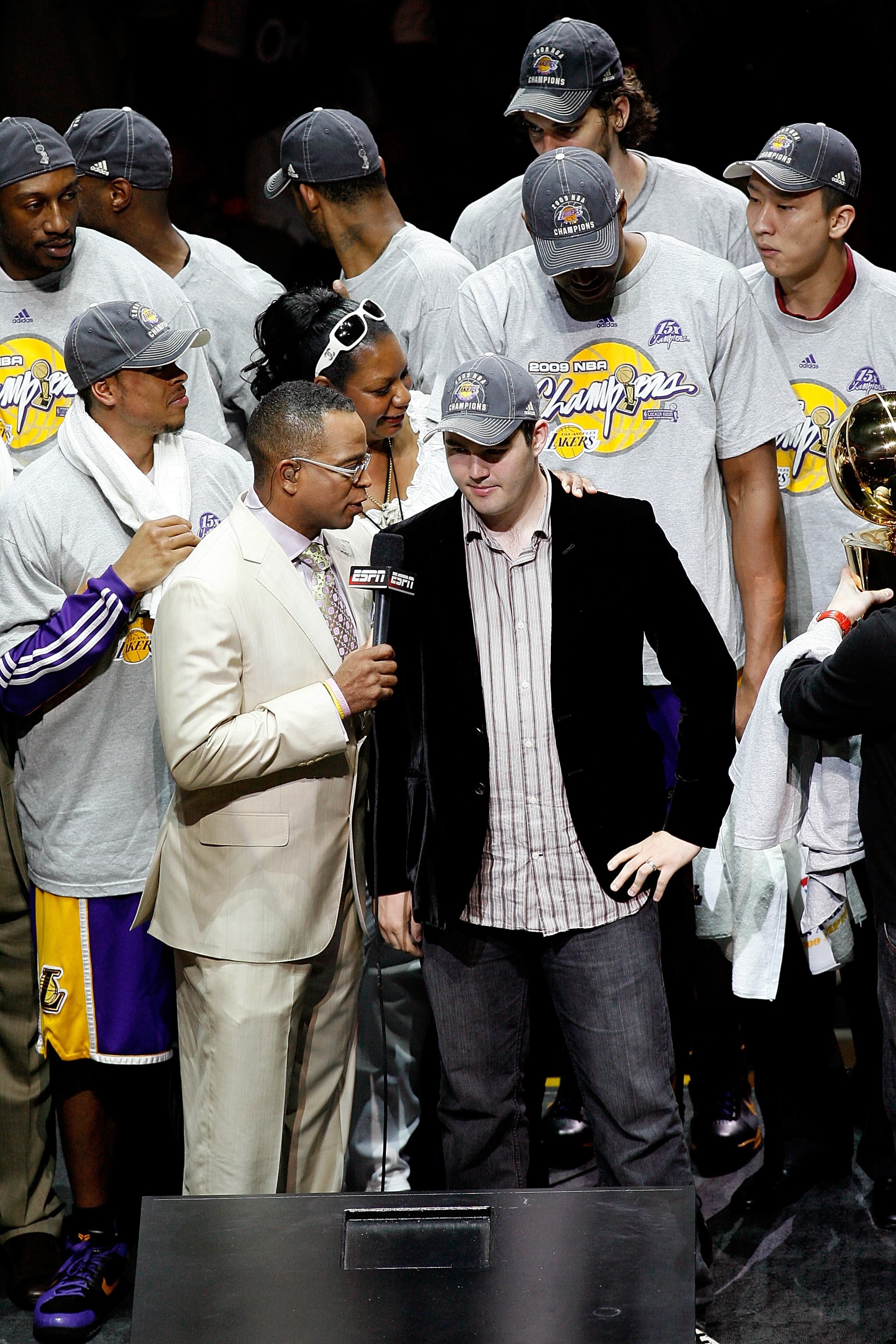 ORLANDO, FL - JUNE 14: ESPN reporter Stuart Scott interviews family representative Joey Buss of the Los Angeles Lakers after the Lakers' win over the Orlando Magic in Game Five of the 2009 NBA Finals on June 14, 2009 at Amway Arena in Orlando, Florida. The Lakers won 99-86. NOTE TO USER: User expressly acknowledges and agrees that, by downloading and or using this photograph, User is consenting to the terms and conditions of the Getty Images License Agreement. (Photo by Chris Graythen/Getty Images)