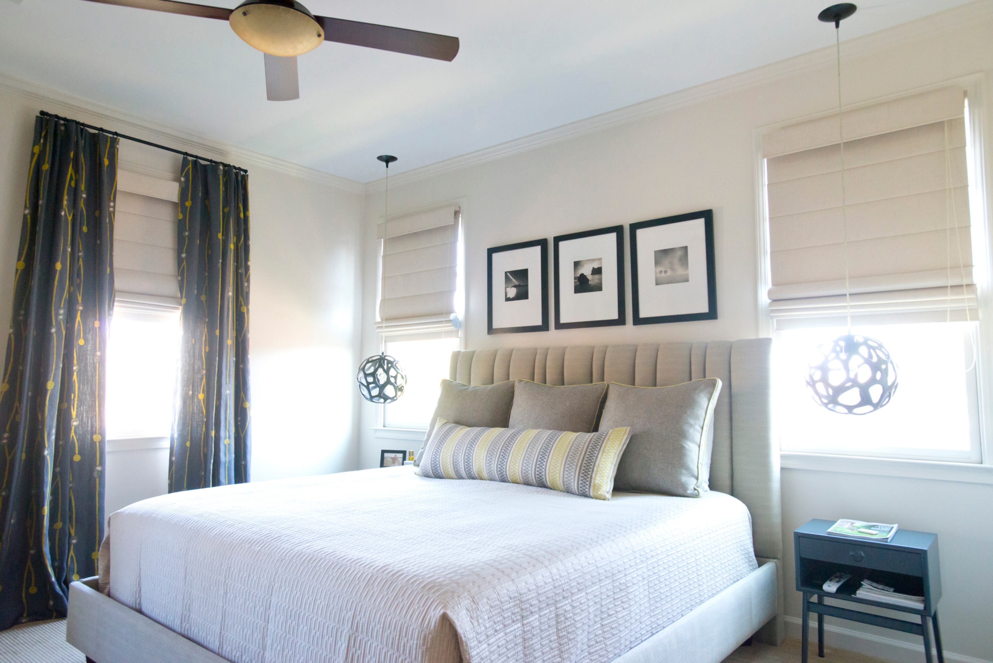 The master bedroom has a small photo collection above the headboard.