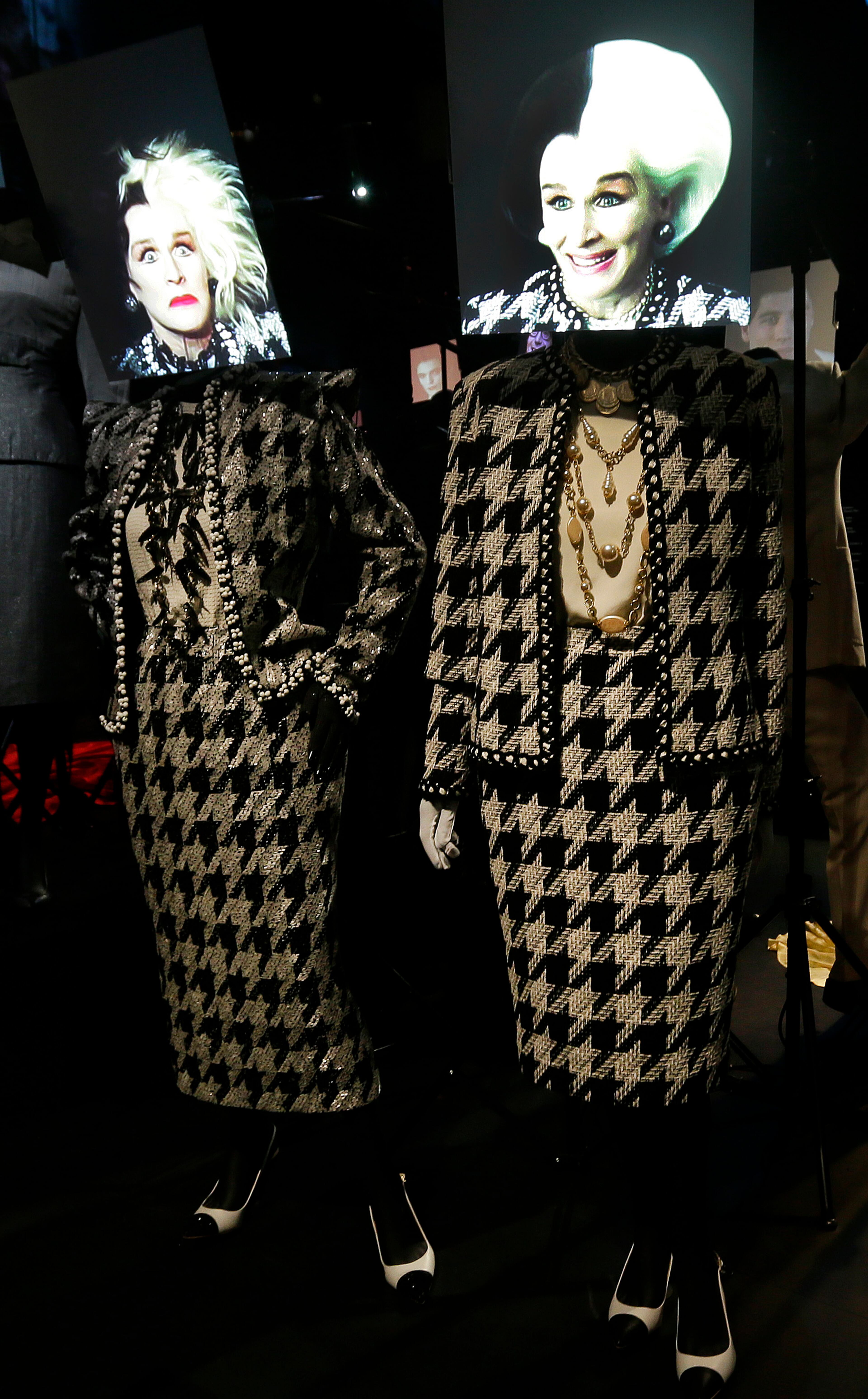 Black and white costumes designed by Anthony Powell for the 2000 film 102 Dalmatians lead female villain Cruella de Vil portrayed by actress Glenn Close on display at the Hollywood Costume exhibition at the Victoria and Albert museum in London.