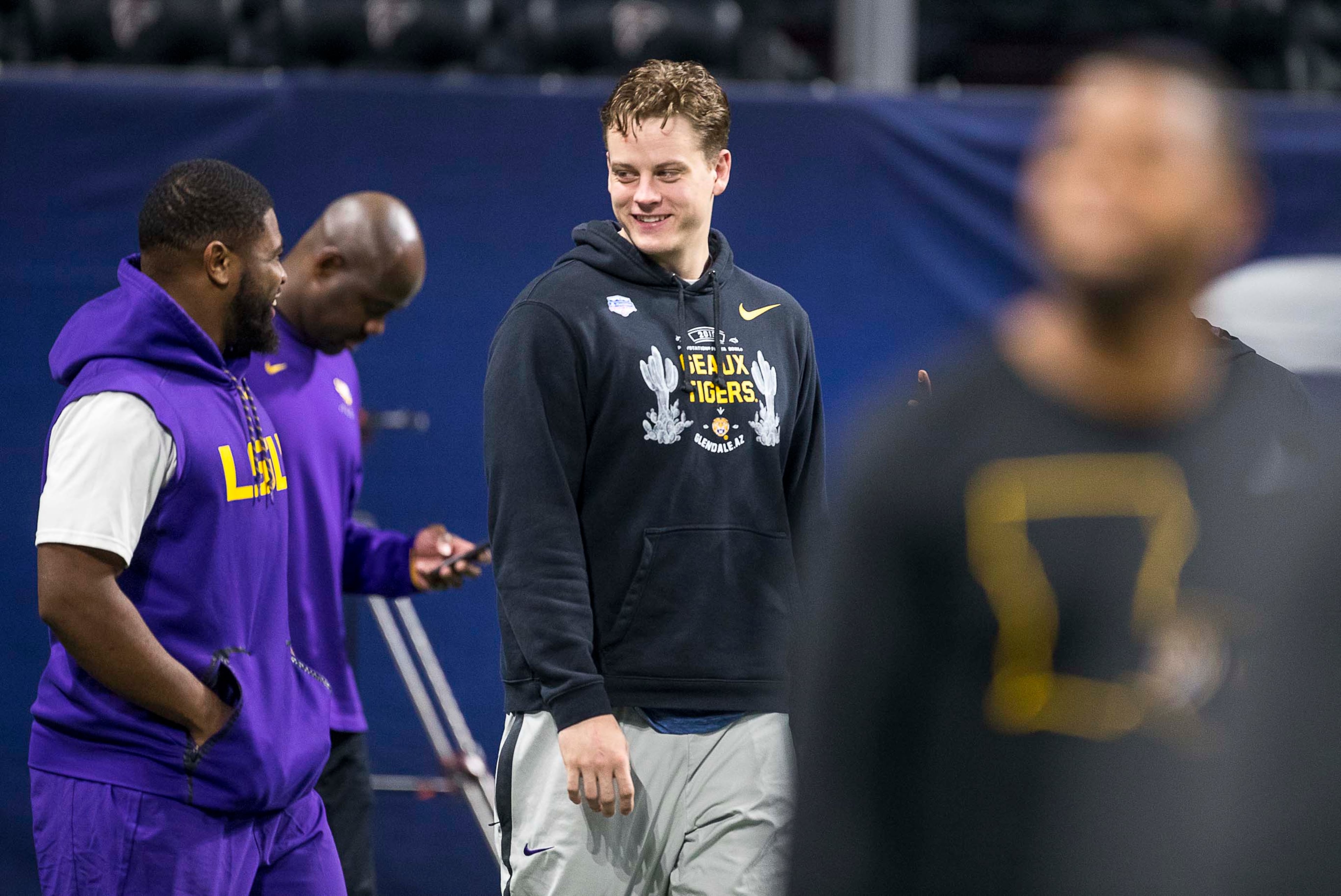 LSU quarterback Joe Burrow (center) takes the field with his team during their practice time at Mercedes-Benz Stadium in Atlanta, Friday, December 6, 2019. The Louisiana State University Tigers take on the University of Georgia Bulldogs during the SEC Championship game on Saturday. (ALYSSA POINTER/ALYSSA.POINTER@AJC.COM)