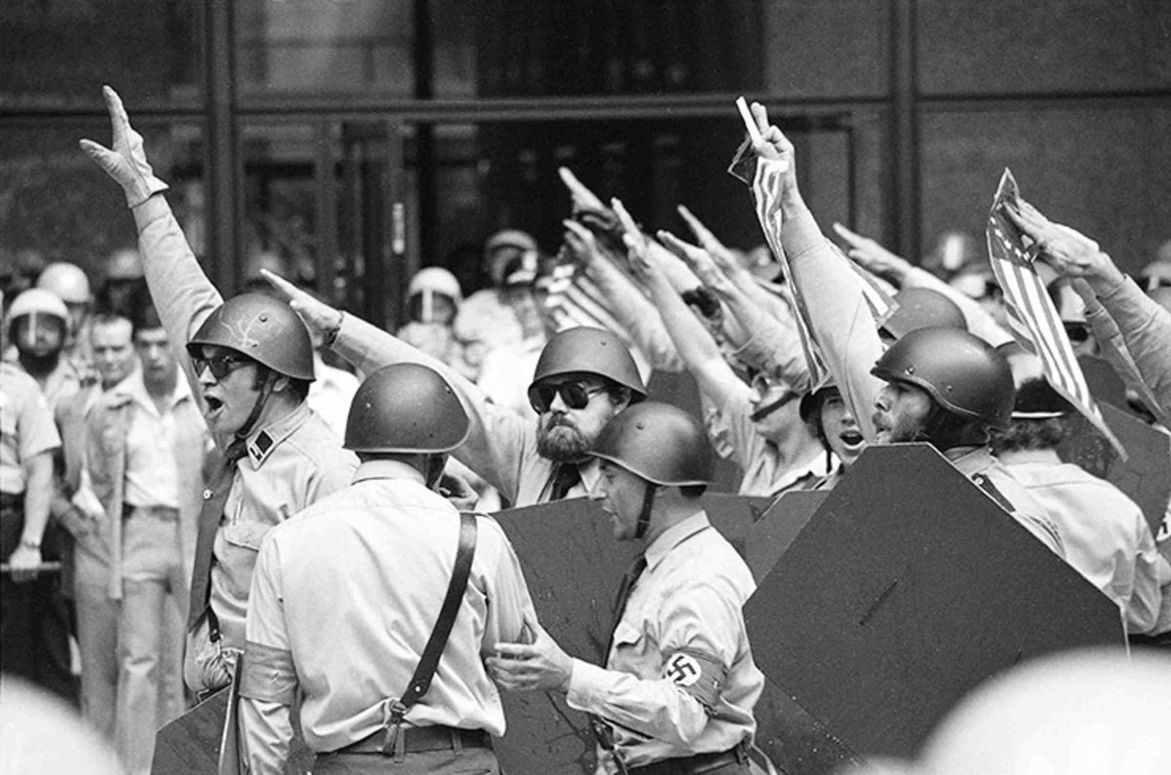 A group of neo-Nazis demonstrating in downtown Chicago in 1978. Frank Collin, the group's leader, foreground with armband, was later convicted on molestation charges. AP photo
