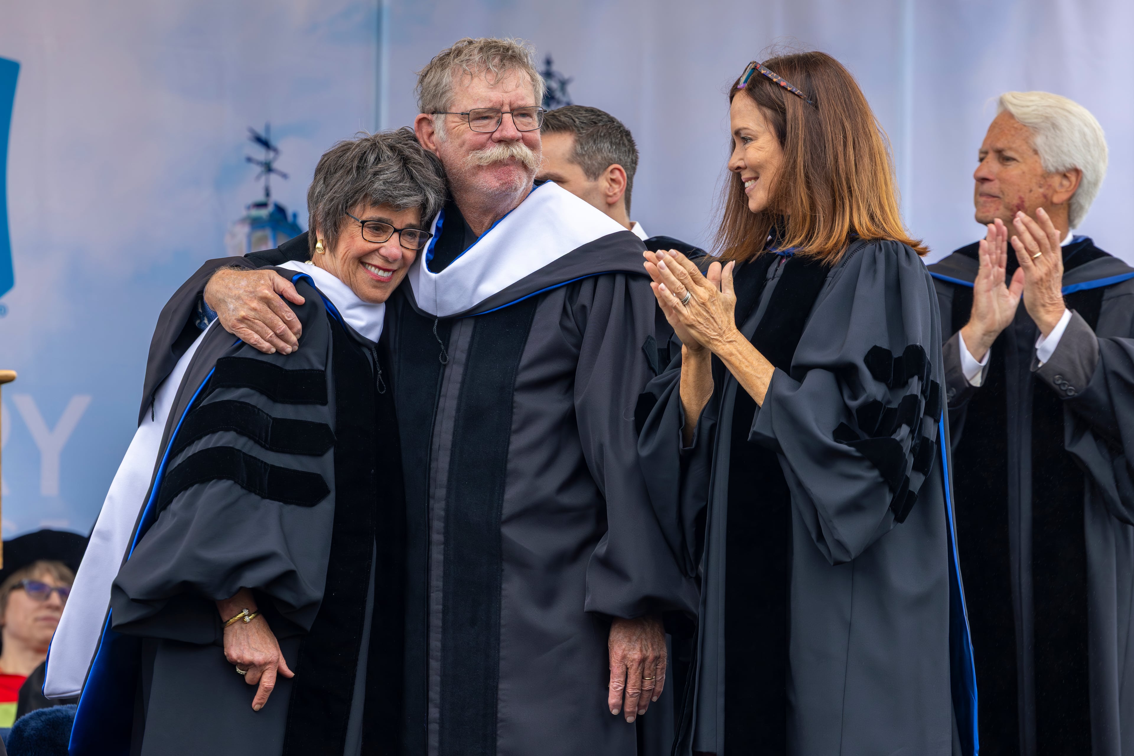 Martha Berry Walstad, great-niece of Berry College founder Martha Berry, and Randy Berry, great-nephew of Martha Berry, were presented honorary degrees by board member Kathleen Kelly at Saturday's commencement ceremony. (Jeff Brown/Berry College)