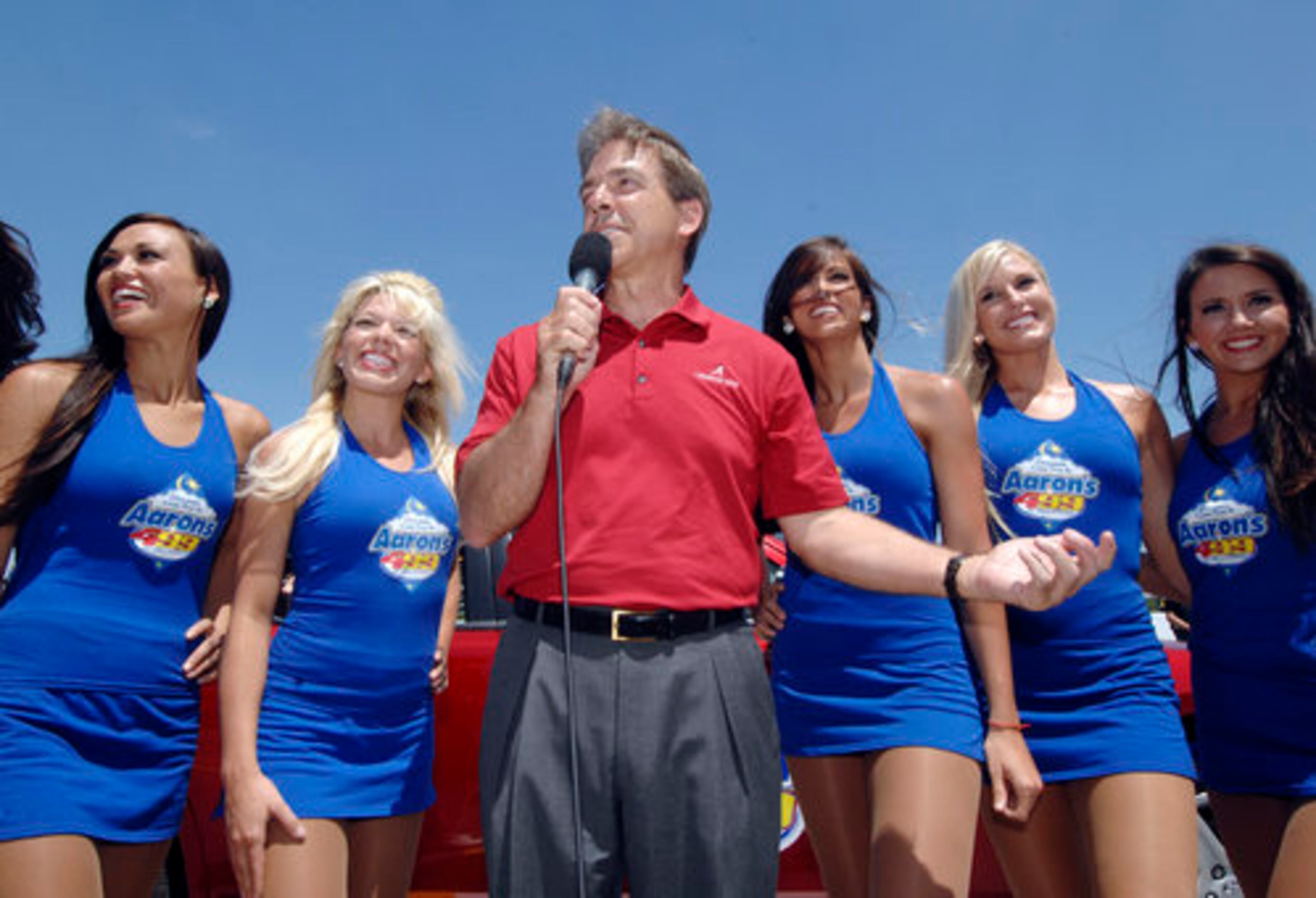Alabama head football coach Nick Saban gives the command for the field to start their engines to begin the Aaron's 499 Sprint Cup Series race at Talladega Superspeedway.